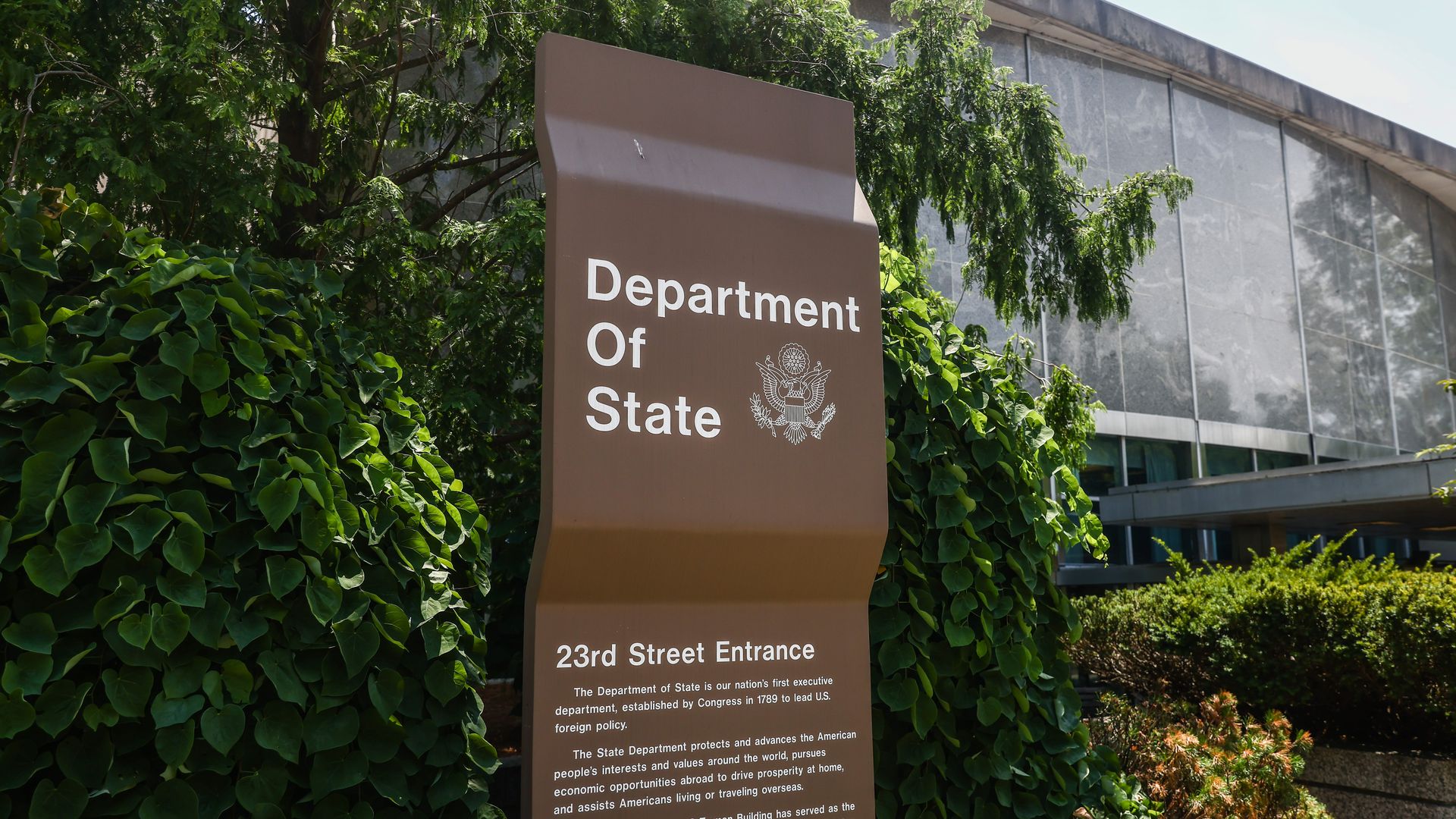 The State Department building with a brown sign that says "Department of State."