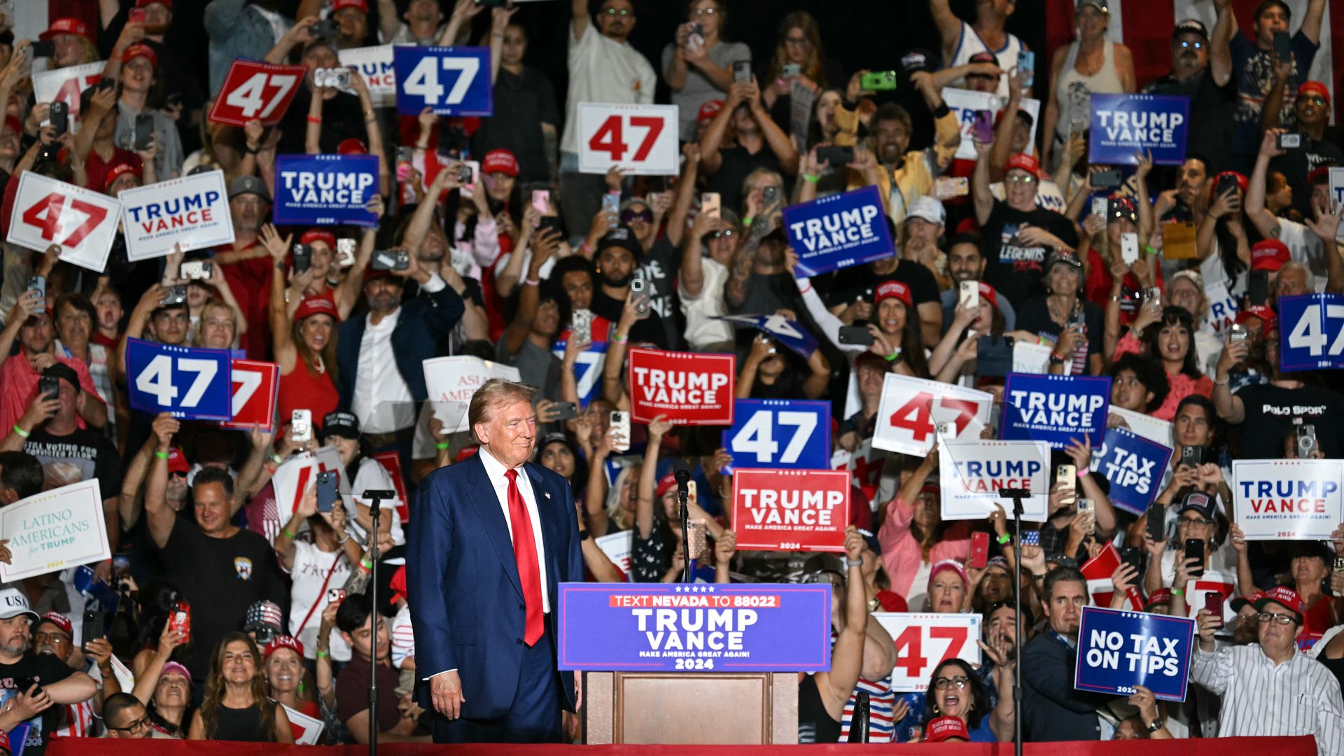 Donald Trump arrives to speak during a campaign rally at the Expo World Market Center in Las Vegas, Nevada, on September 13
