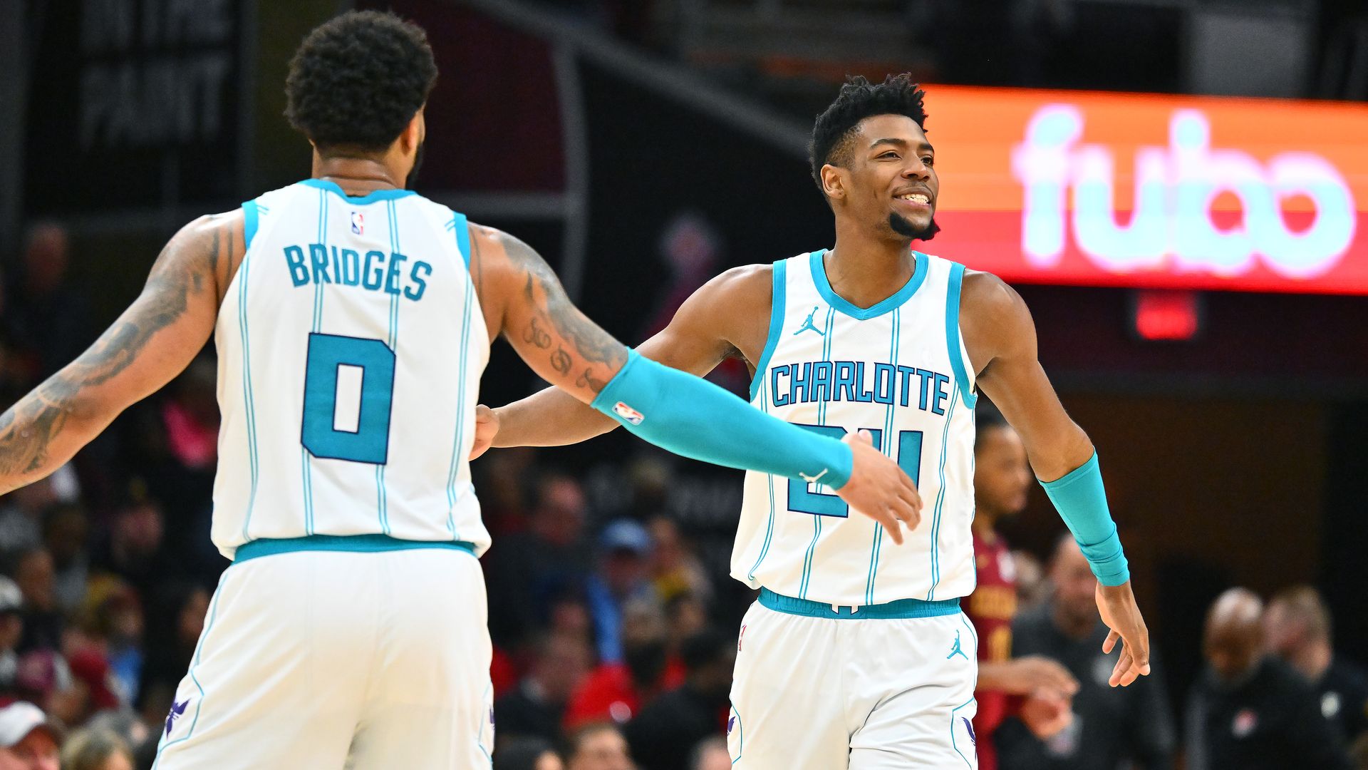  Miles Bridges #0 celebrates with Brandon Miller #24 of the Charlotte Hornets during the third quarter against the Cleveland Cavaliers at Rocket Mortgage Fieldhouse on January 05, 2025 in Cleveland, Ohio. The Cavaliers defeated the Hornets 115-105. NOTE TO USER: User expressly acknowledges and agree
