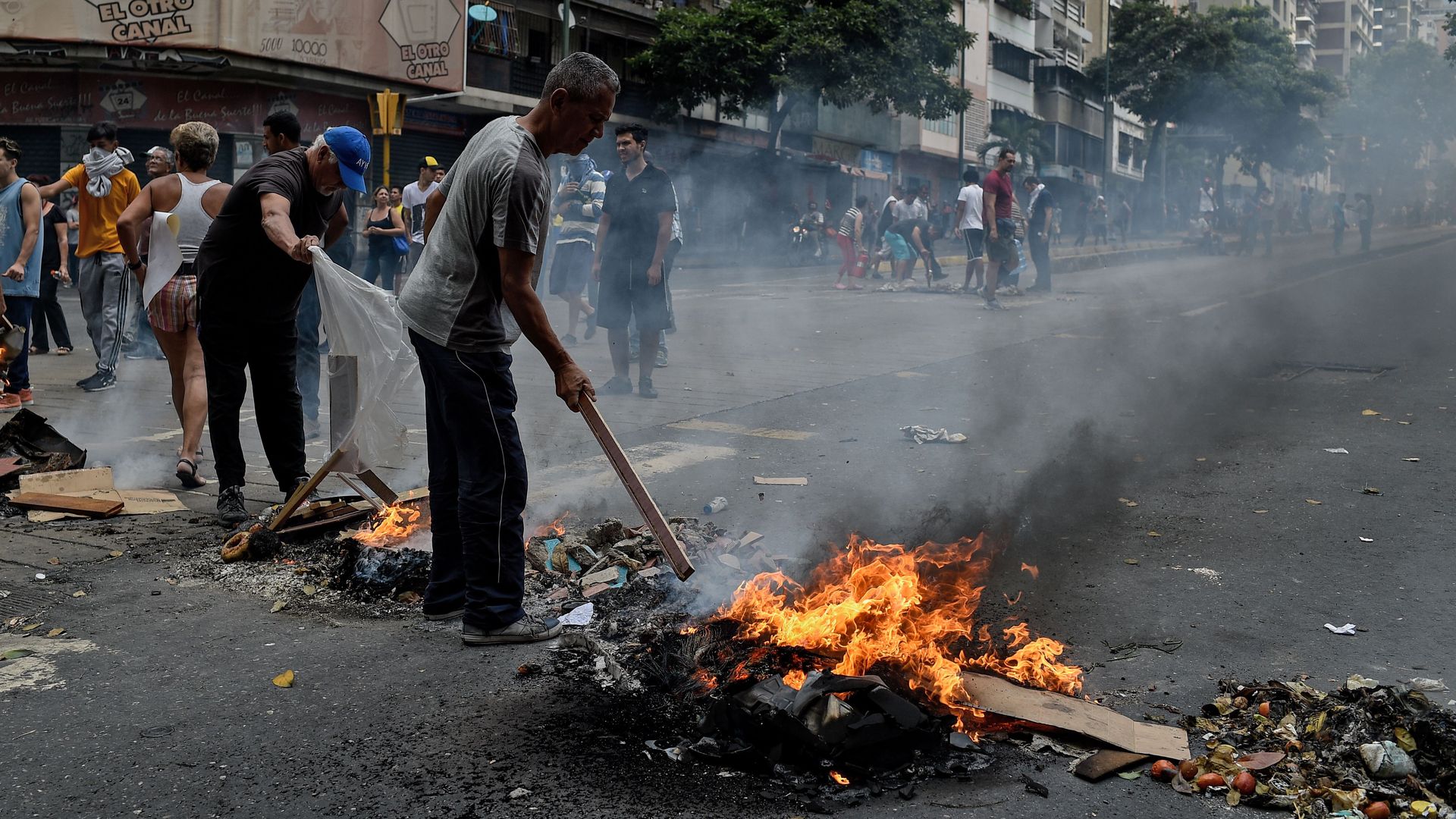 People protest for the lack of water and electric service during a new power outage in Venezuela.