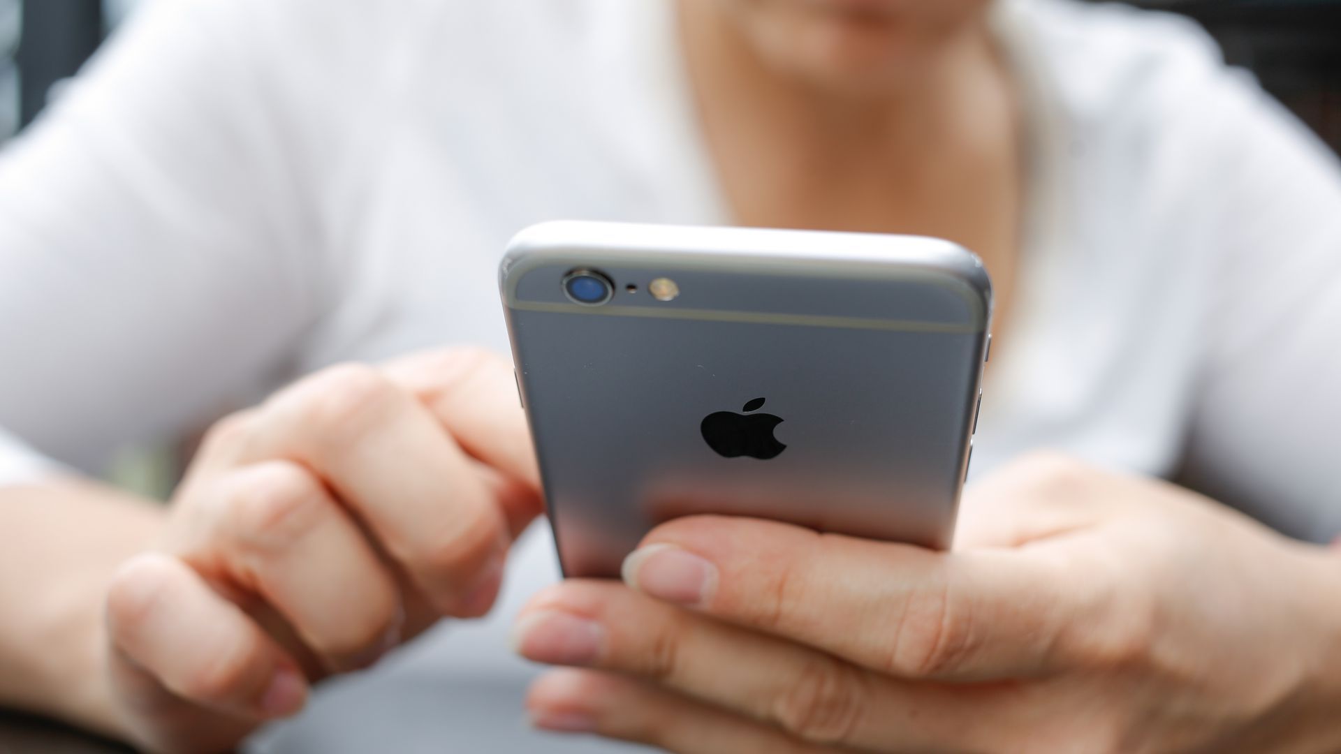 WOman holding an iphone