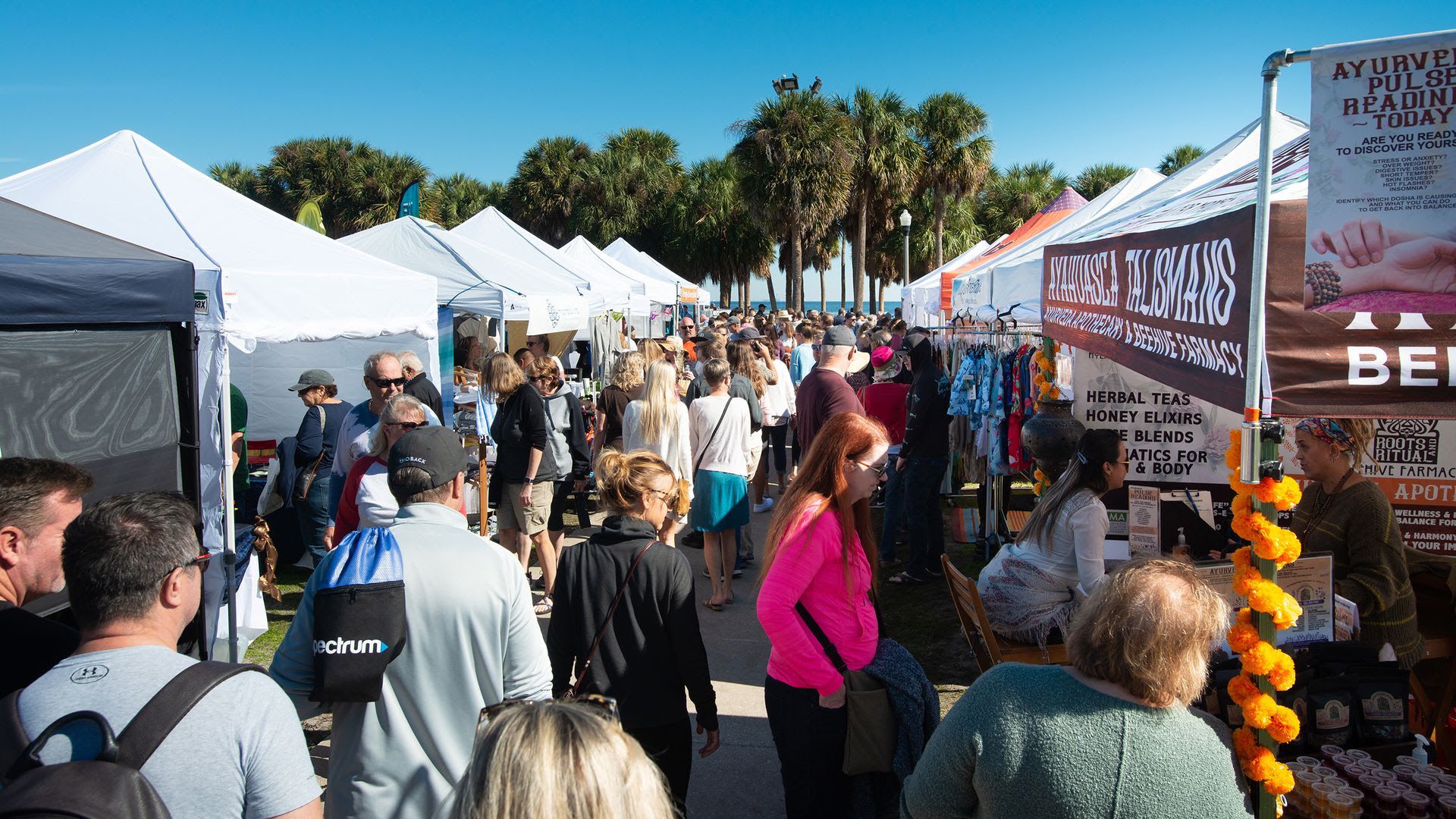 People crowd around tents and vendors at Shopapalooza 2021.