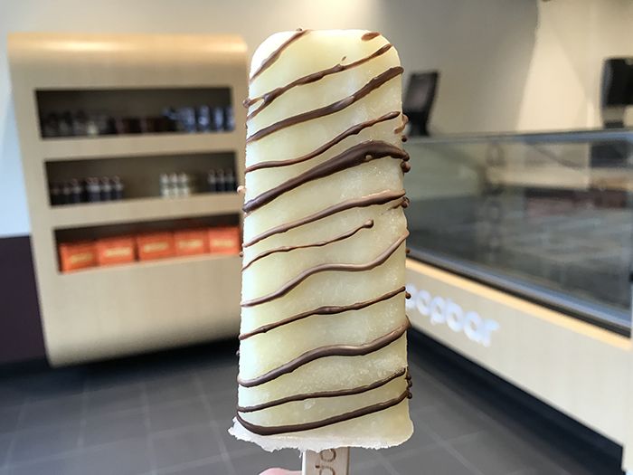 Pineapple sorbet pop with a dark chocolate drizzle