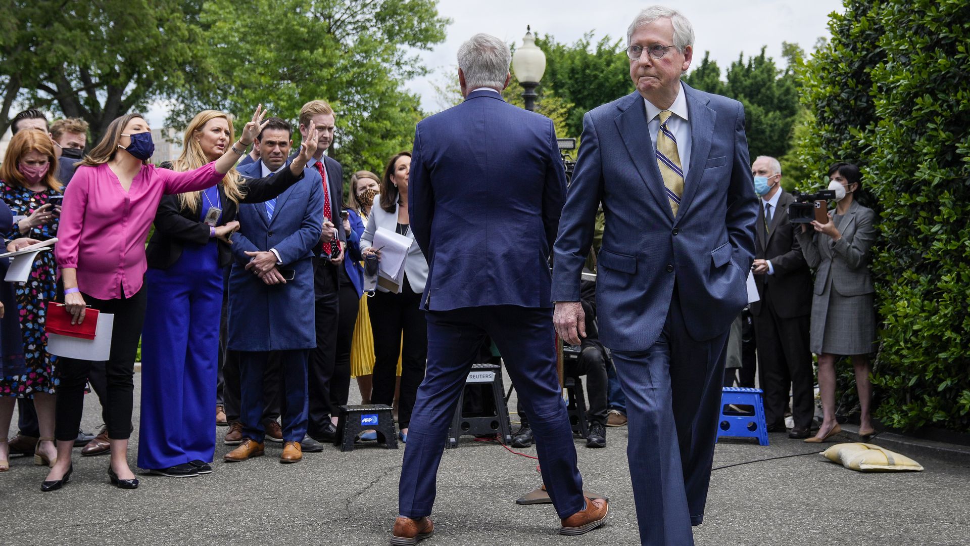 Senate Minority Leader Mitch McConnell is seen leaving House Minority Leader Kevin McCarthy after he made remarks at the White House.