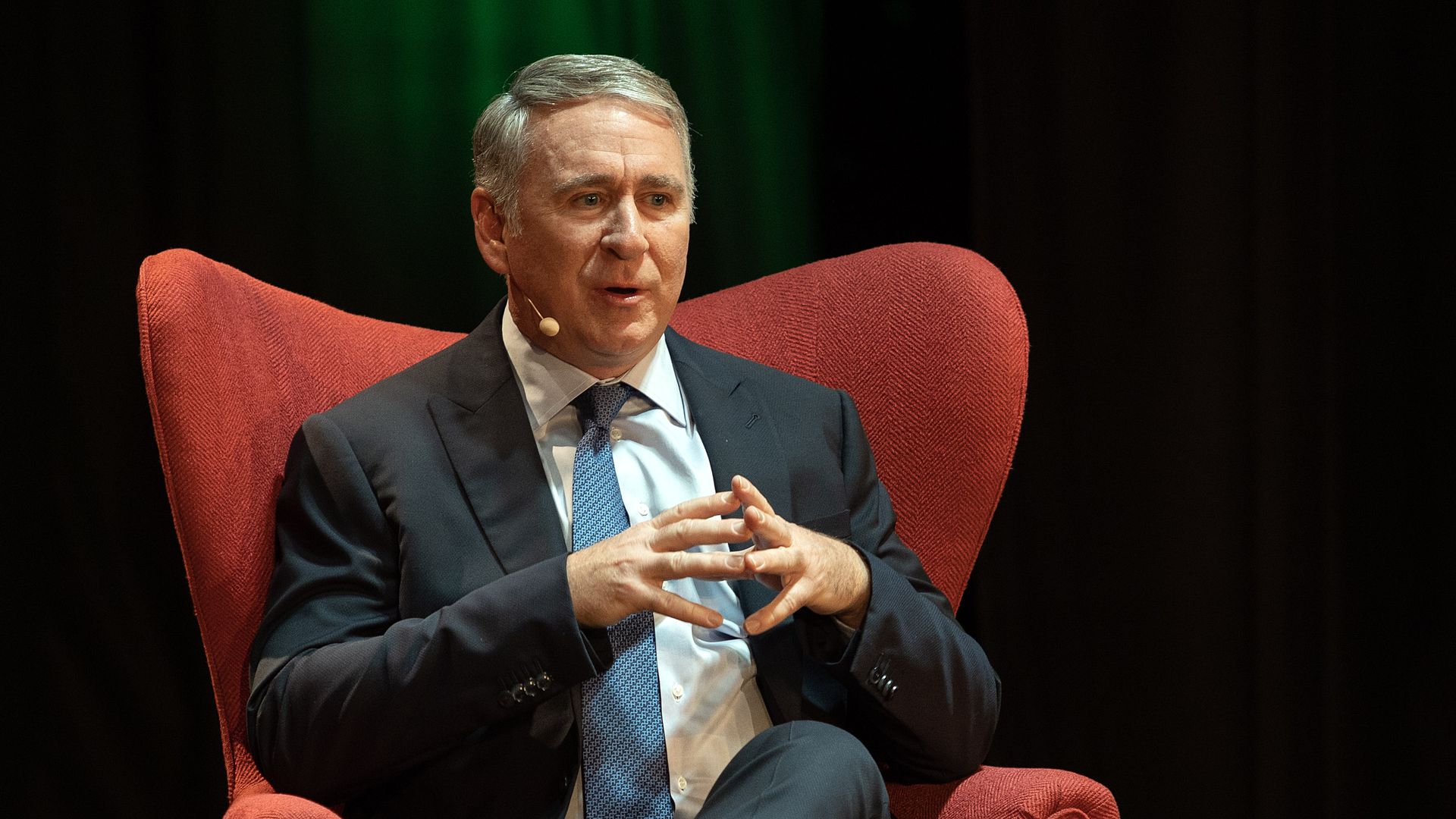 Billionaire hedge fund founder Ken Griffin seated during a seminar.