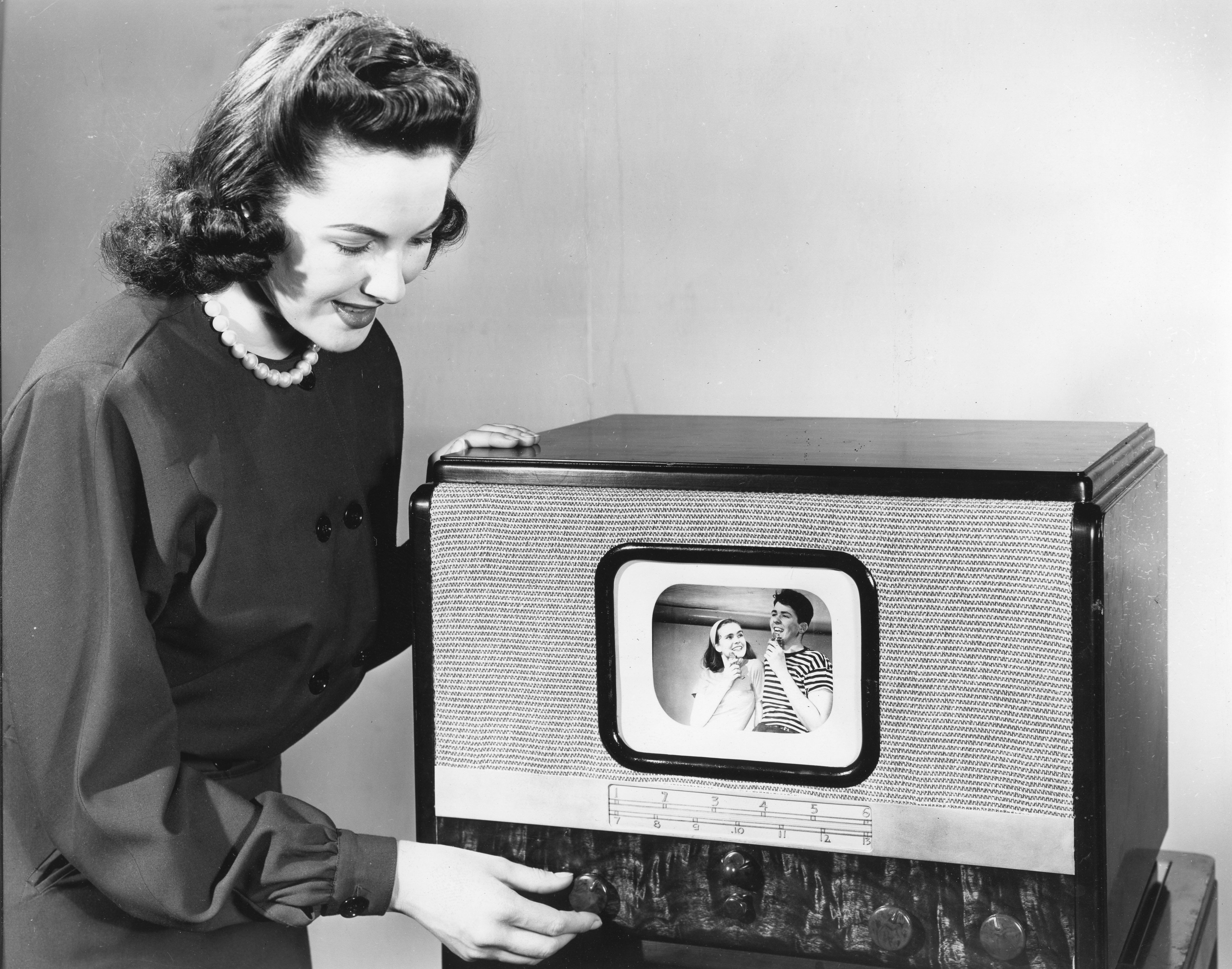 Photo of a woman watching a television set 