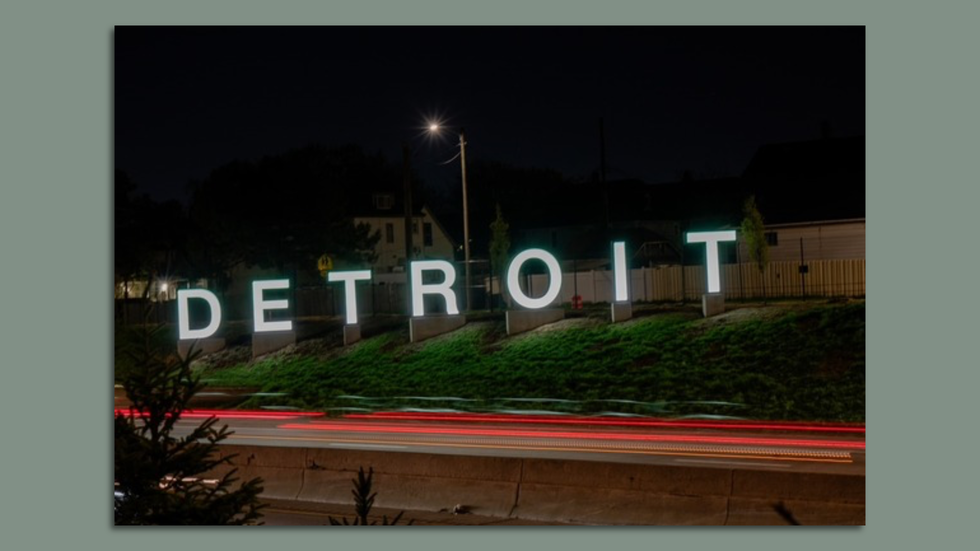 Detroit sign at night. Photo by Montez Miller via city of Detroit