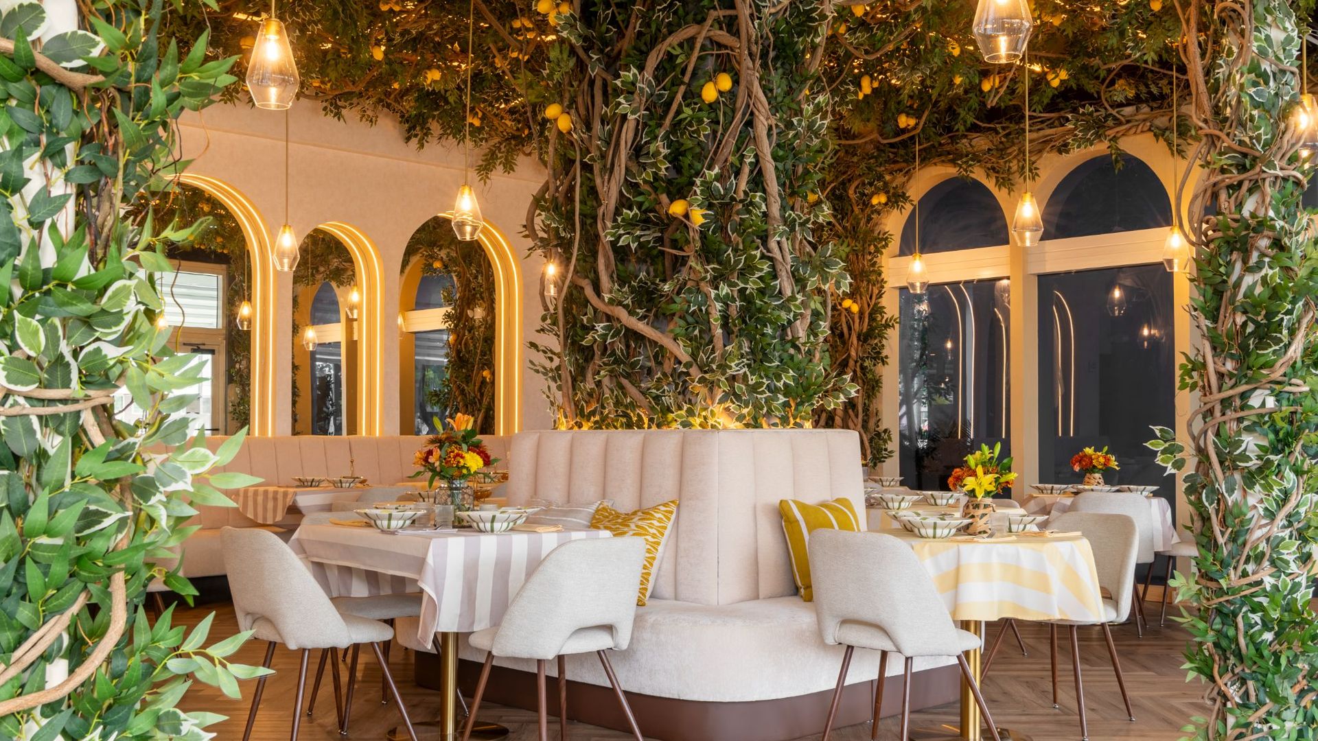 Artificial lemons hang over a dining room at a new Wynwood restaurant.