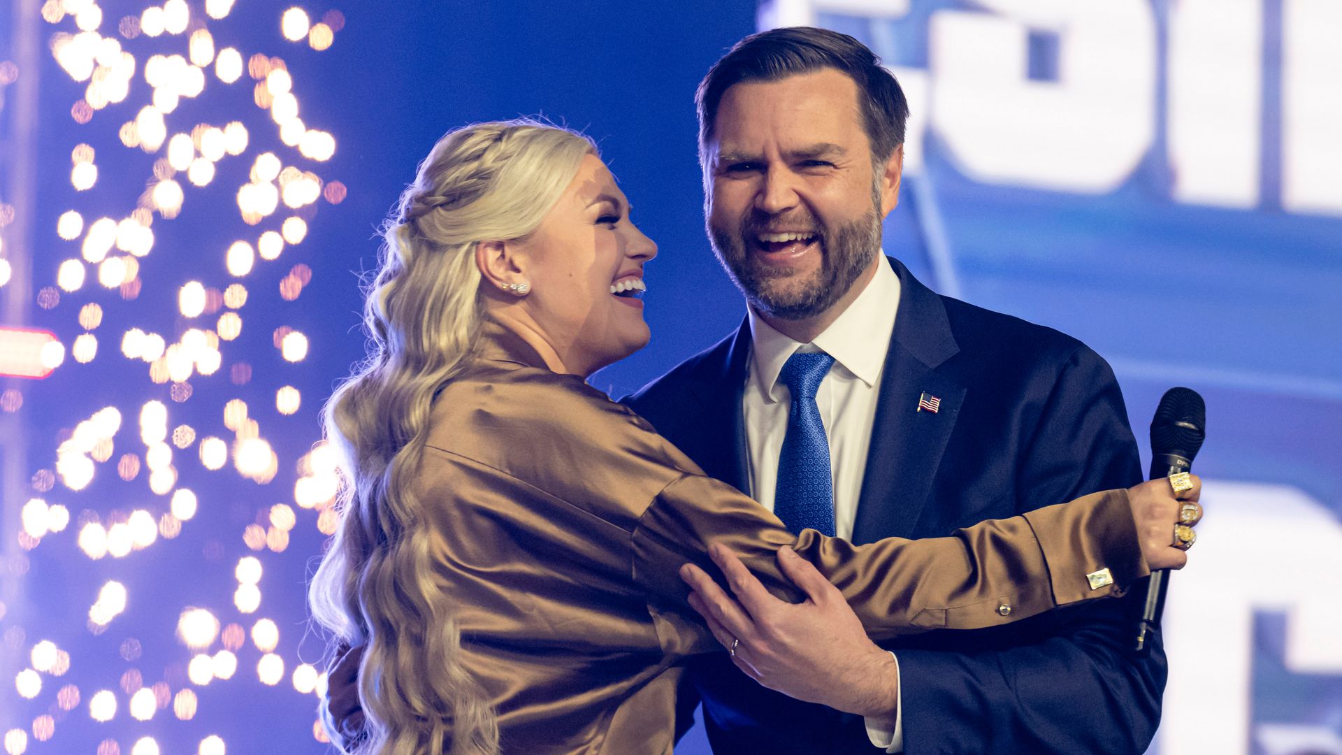 Erika Kirk greets Vice President Vance during Turning Point USA's AmericaFest summit on Sunday.