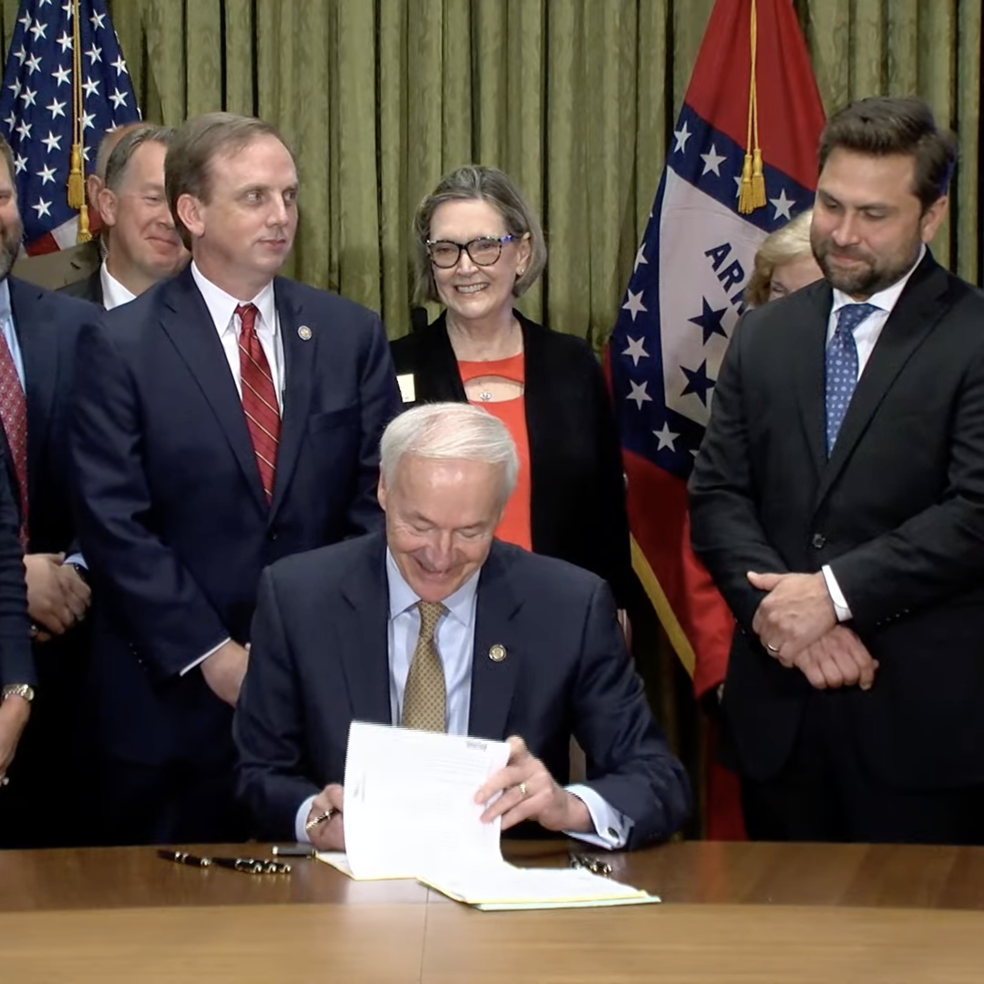 Arkansas Gov. Asa Hutchinson signs tax cut legislation.