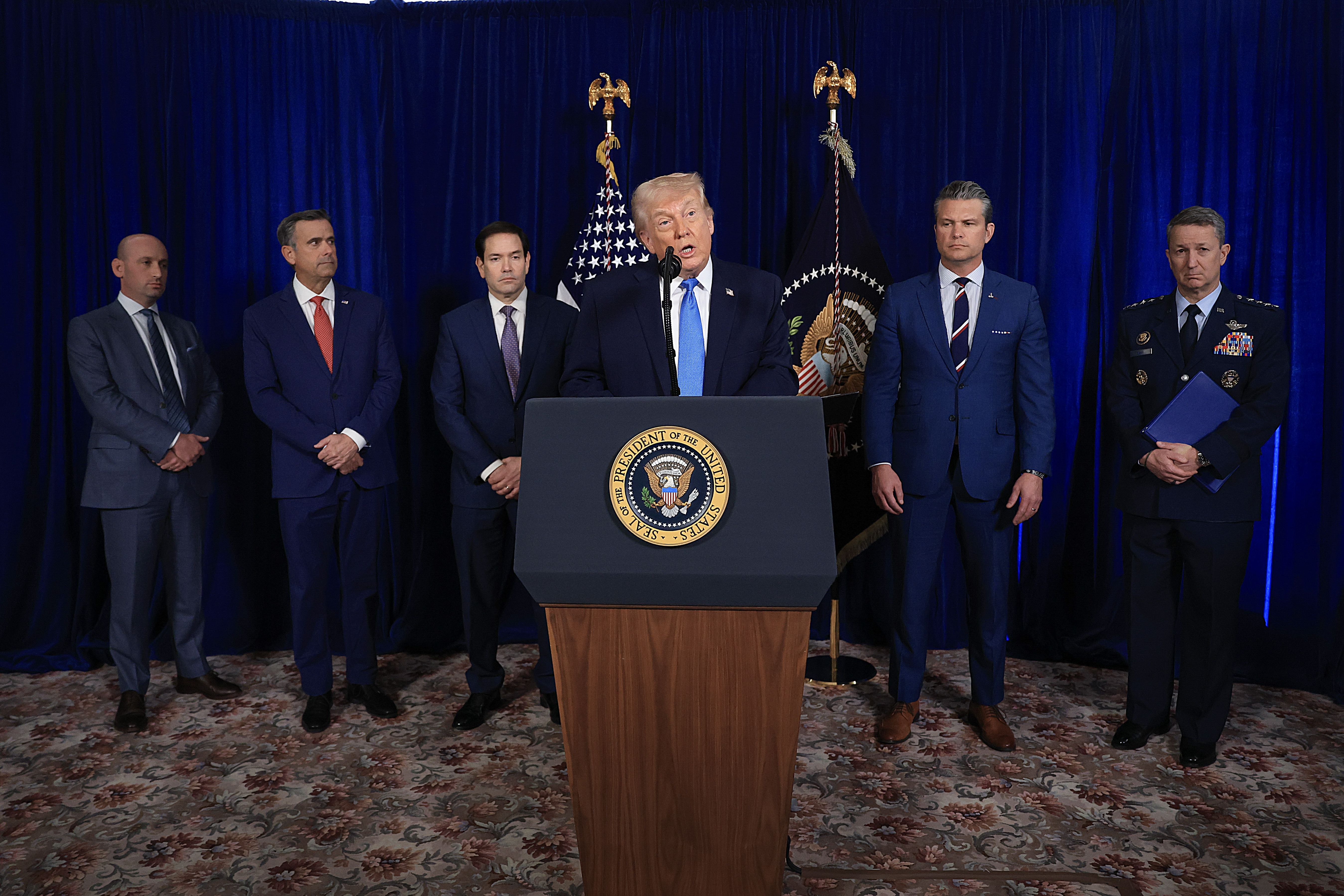 Behind President Trump at today's news conference at Mar-a-Lago, from left: Stephen Miller, CIA Director John Ratcliffe, Secretary of State Marco Rubio, Secretary of Defense Peter Hegseth and Chairman of the Joint Chiefs of Staff Dan Caine. Photo: Joe Raedle/Getty Images