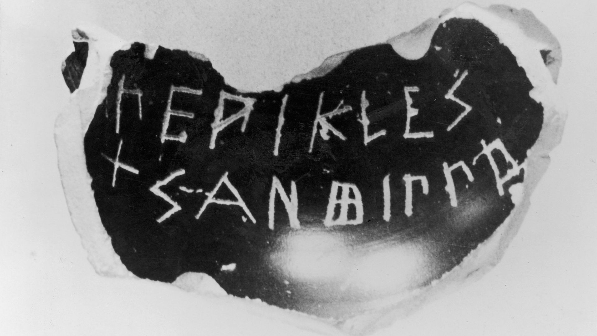 Photo of a potshard with Greek writing.