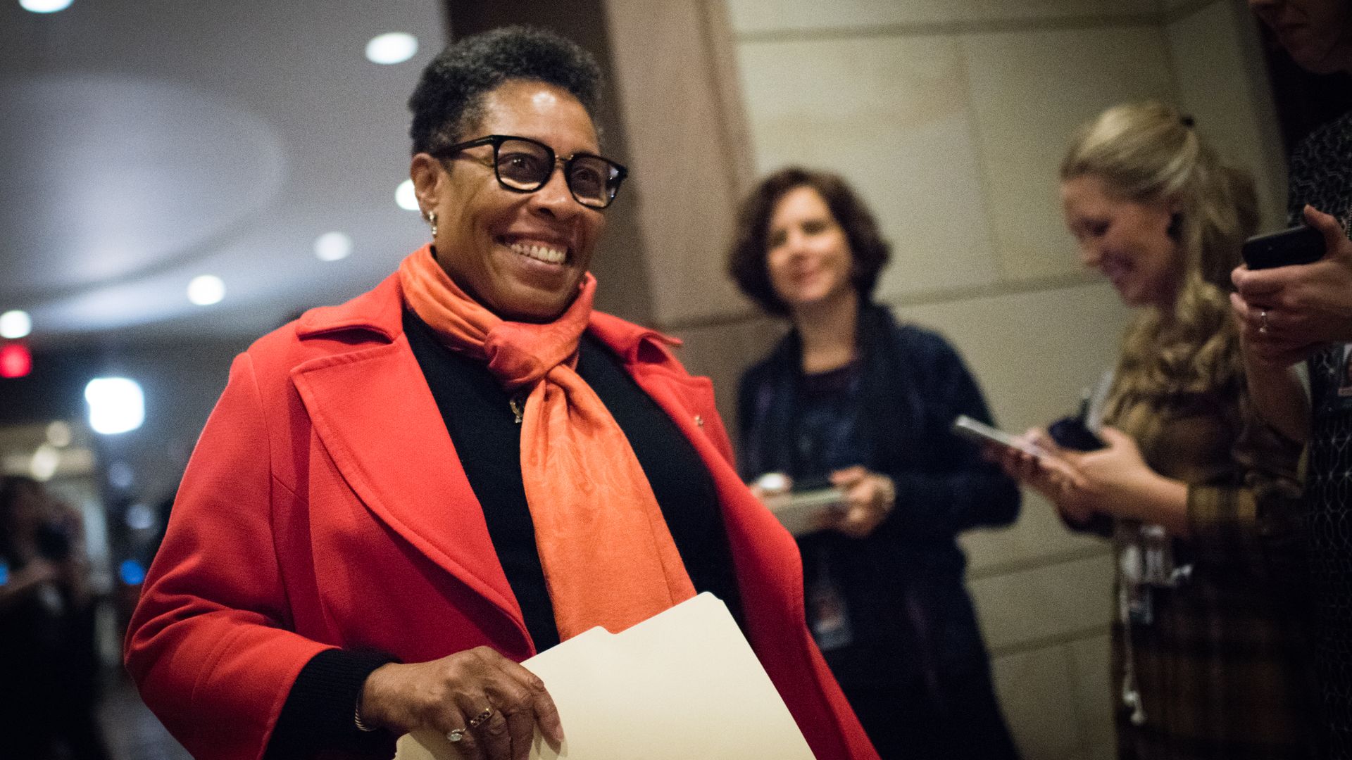 Rep. Marcia Fudge smiles as she walks through the U.S. Capitol.