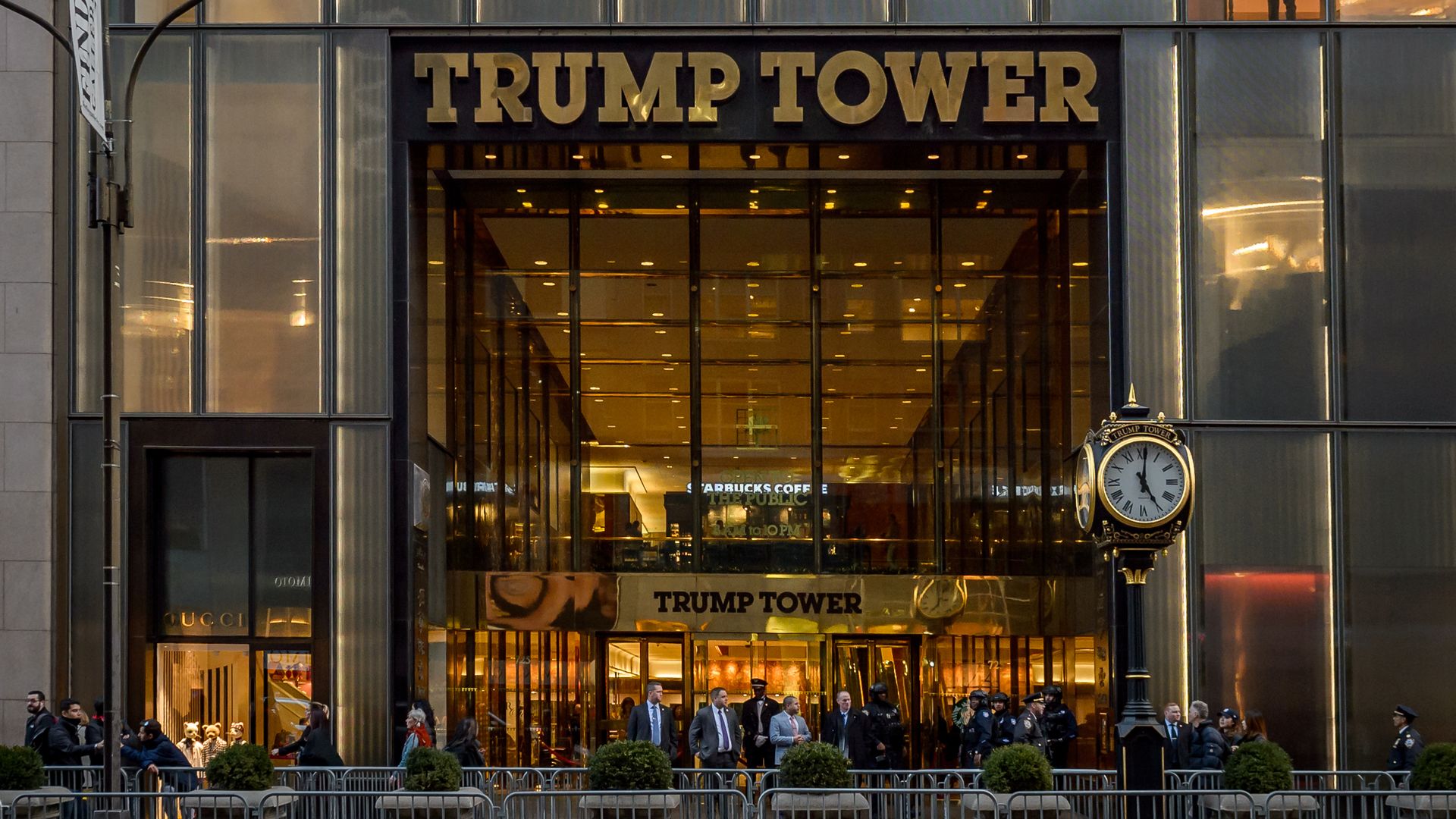 This image shows the front doors of Trump Tower, which are blocked off by concrete barriers.