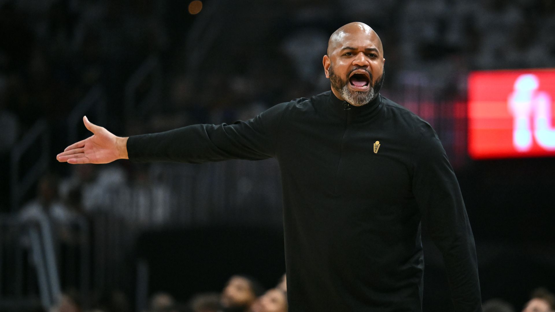 Cavs head coach JB Bickerstaff complaining to referees on the sideline