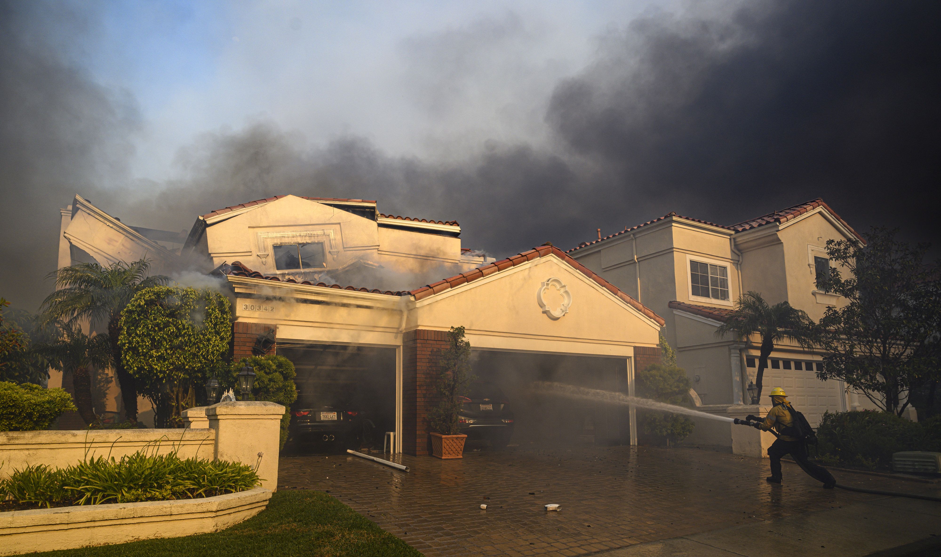 A house on La Vue in in Laguna Niguel burns in the Costal Fire on Wednesday, May 11.