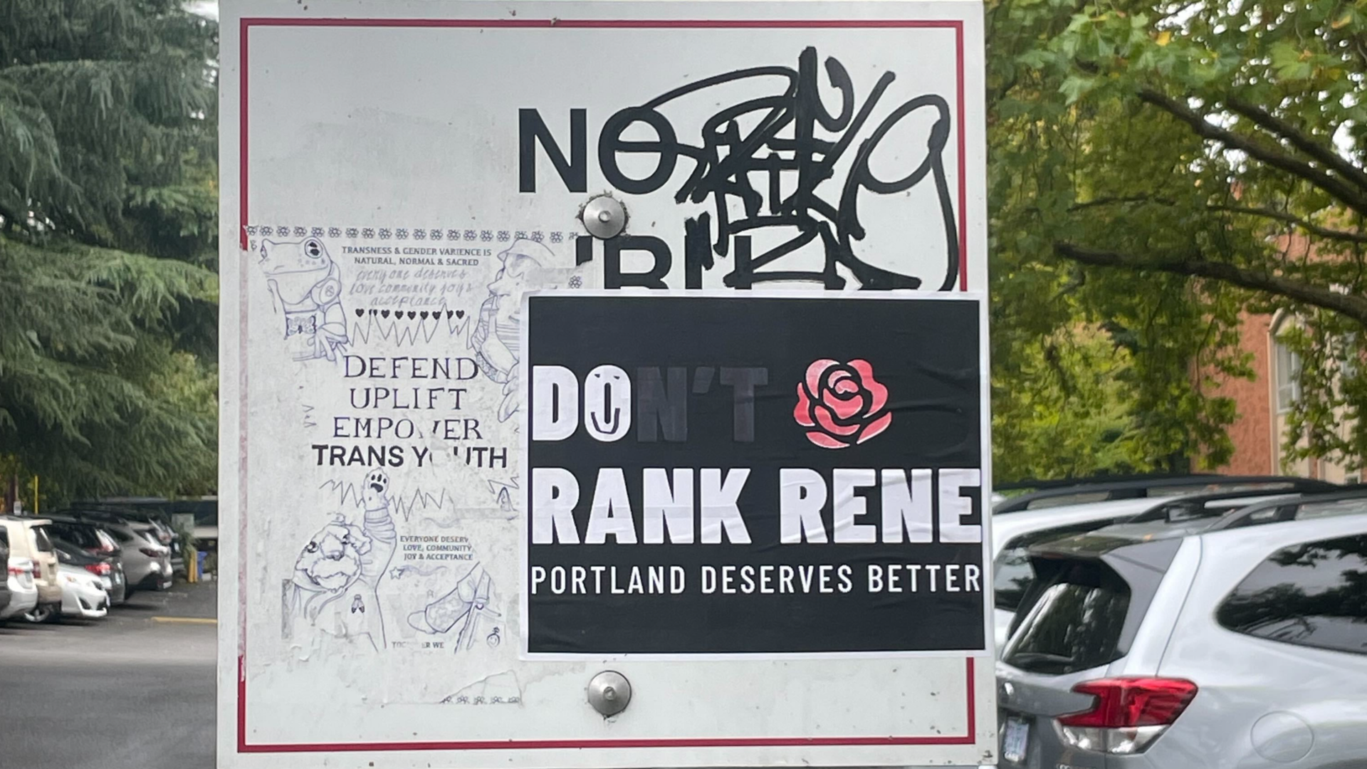 A photo showing a sticker that reads "don't rank Rene" with the "n't" crossed out in black marker.