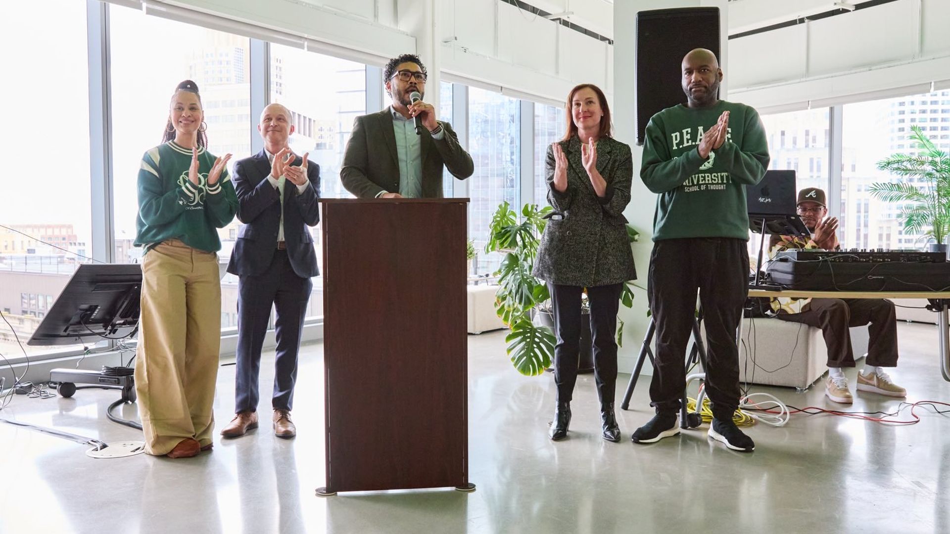 Imari Paris Jeffries, center, speaks at the podium surrounded by other organizers of the Everyone250 campaign ahead of America's 250th anniversary.
