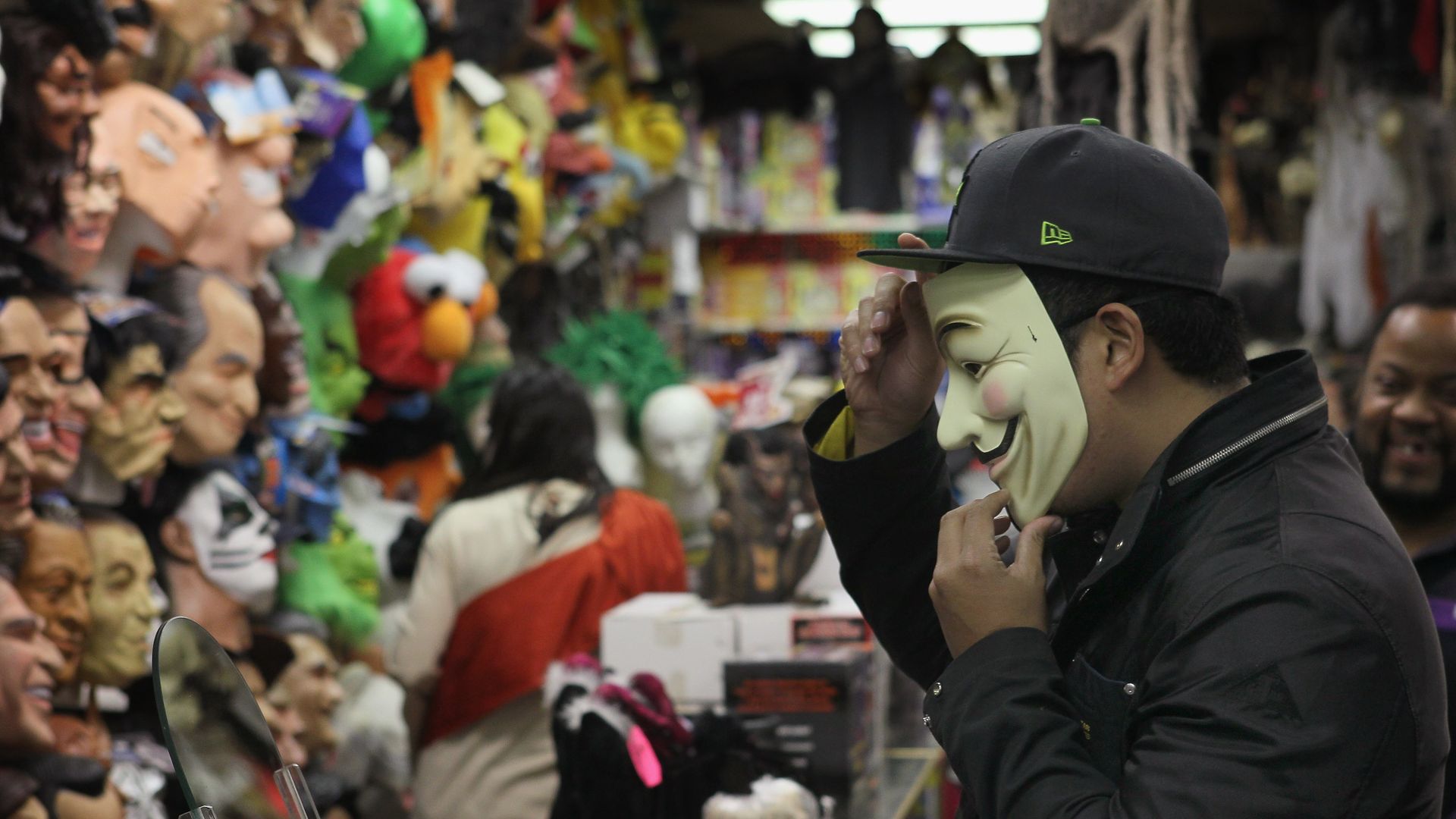 guyi trying on halloween mask