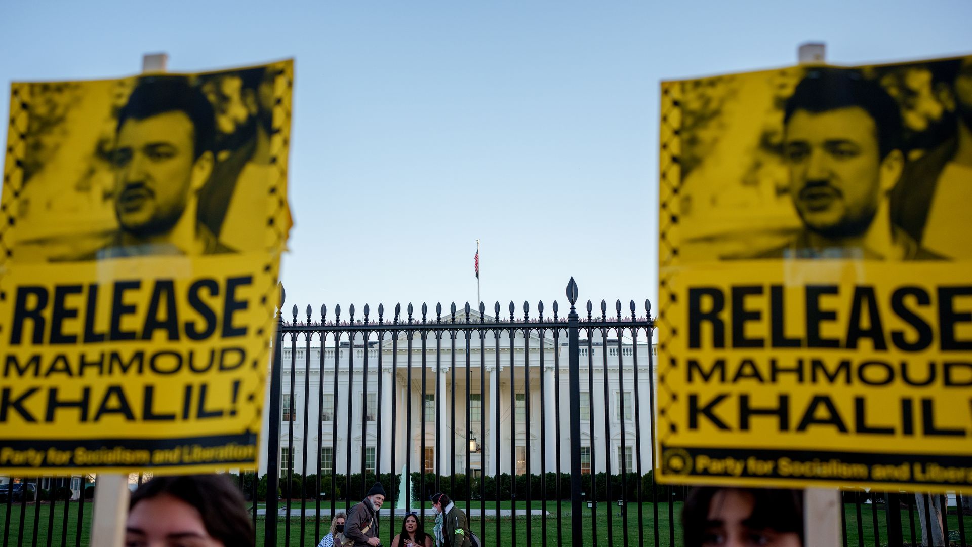 WASHINGTON, DC - MARCH 18: Protestors hold signs calling for the release of Columbia University student, Mahmoud Khalil, who has been arrested for his involvement with campus protests against Israel, during a rally outside the White House against Israeli bombing of Gaza on March 18, 2025 in Washingt