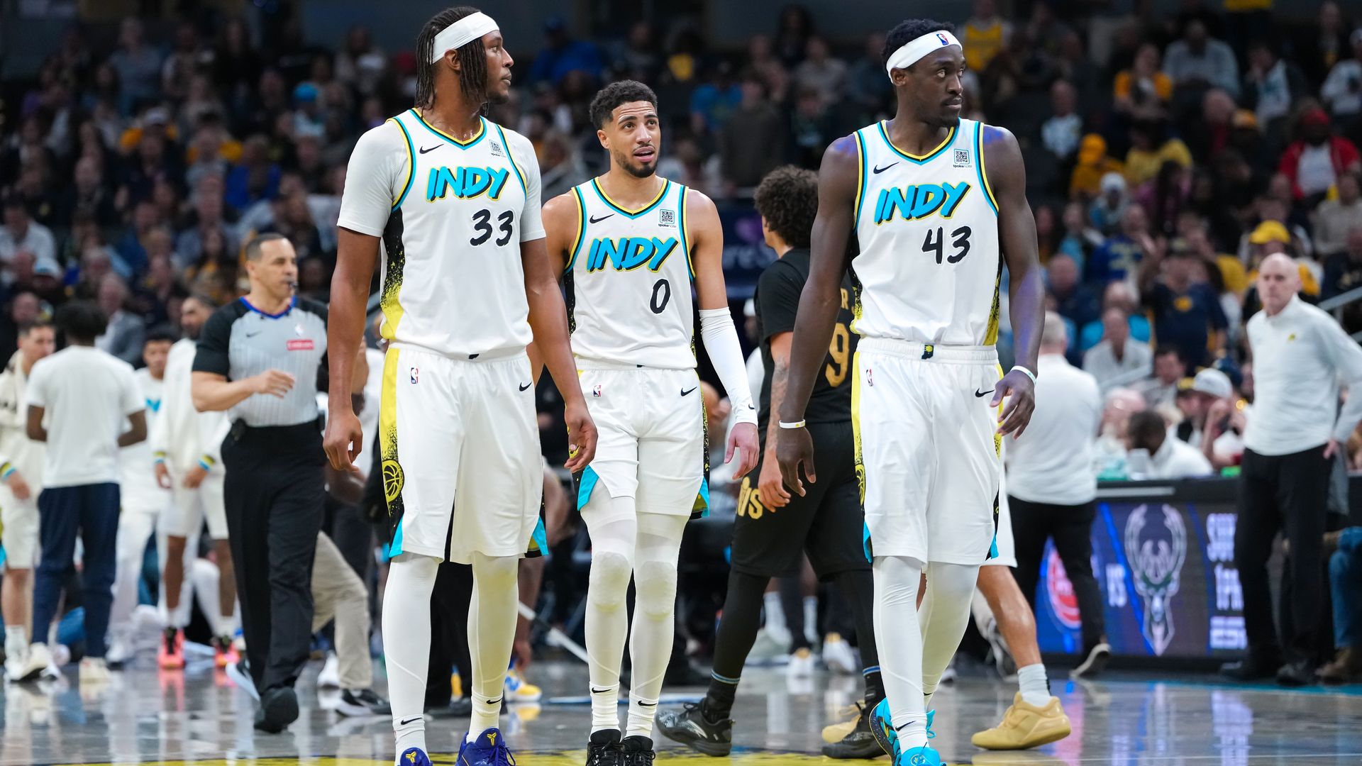 Myles Turner #33, Tyrese Haliburton #0, and Pascal Siakam #43 of the Indiana Pacers walks across the court in the fourth quarter against the Cleveland Cavaliers at Gainbridge Fieldhouse on April 10, 2025 in Indianapolis, Indiana.