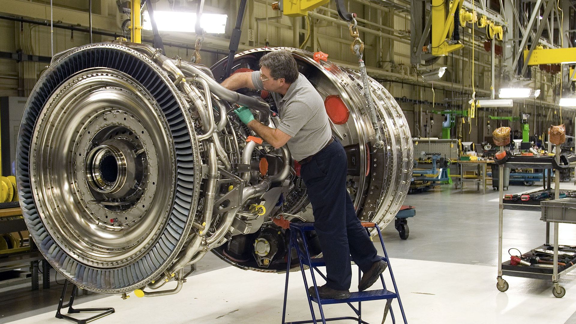 Technician Mike Anderson assembles a General Electric Co. GP7200 jet engine for a Boeing 777 at the company's Aviation Assembly & Test facility in Research Triangle Park in Durham, North Carolina, U.S., on Friday, Jan. 22, 2010. General Electric Co.'s fourth-quarter profit fell less than analysts es