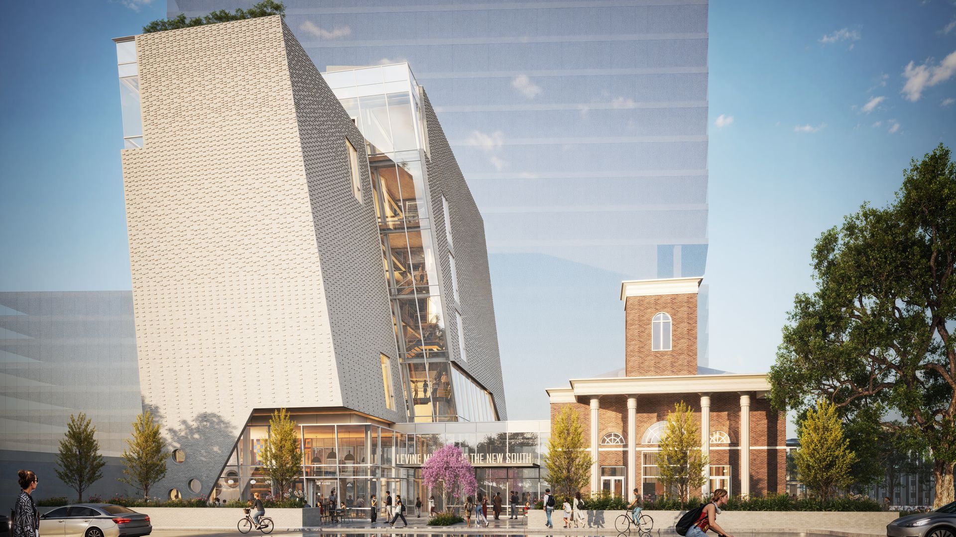 Modern brick and glass building labeled "Levine Museum of the New South" beside a historic red brick building with columns, surrounded by trees, people, cars, and a cyclist.