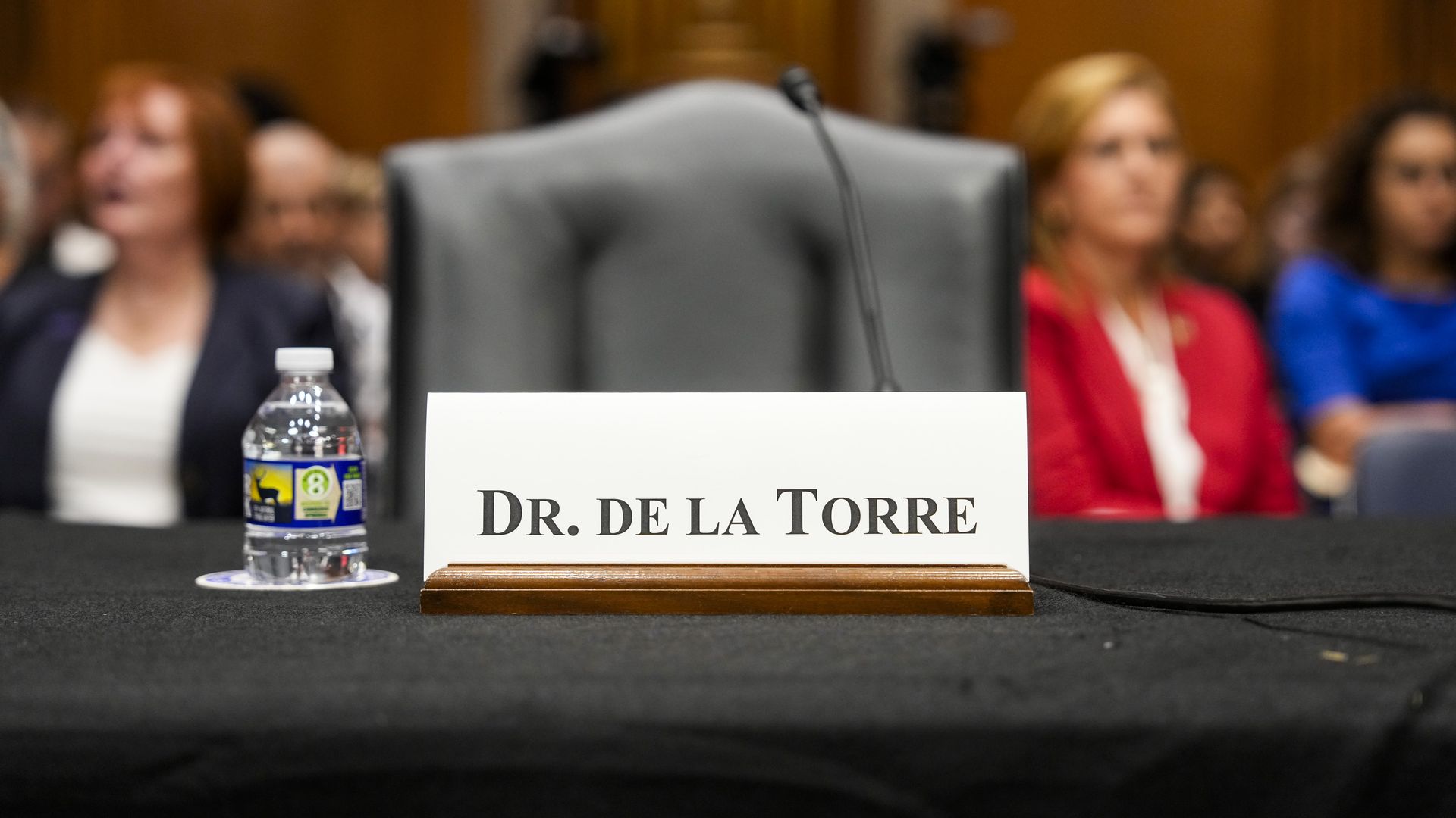 Empty witness chair at Steward Health hearing