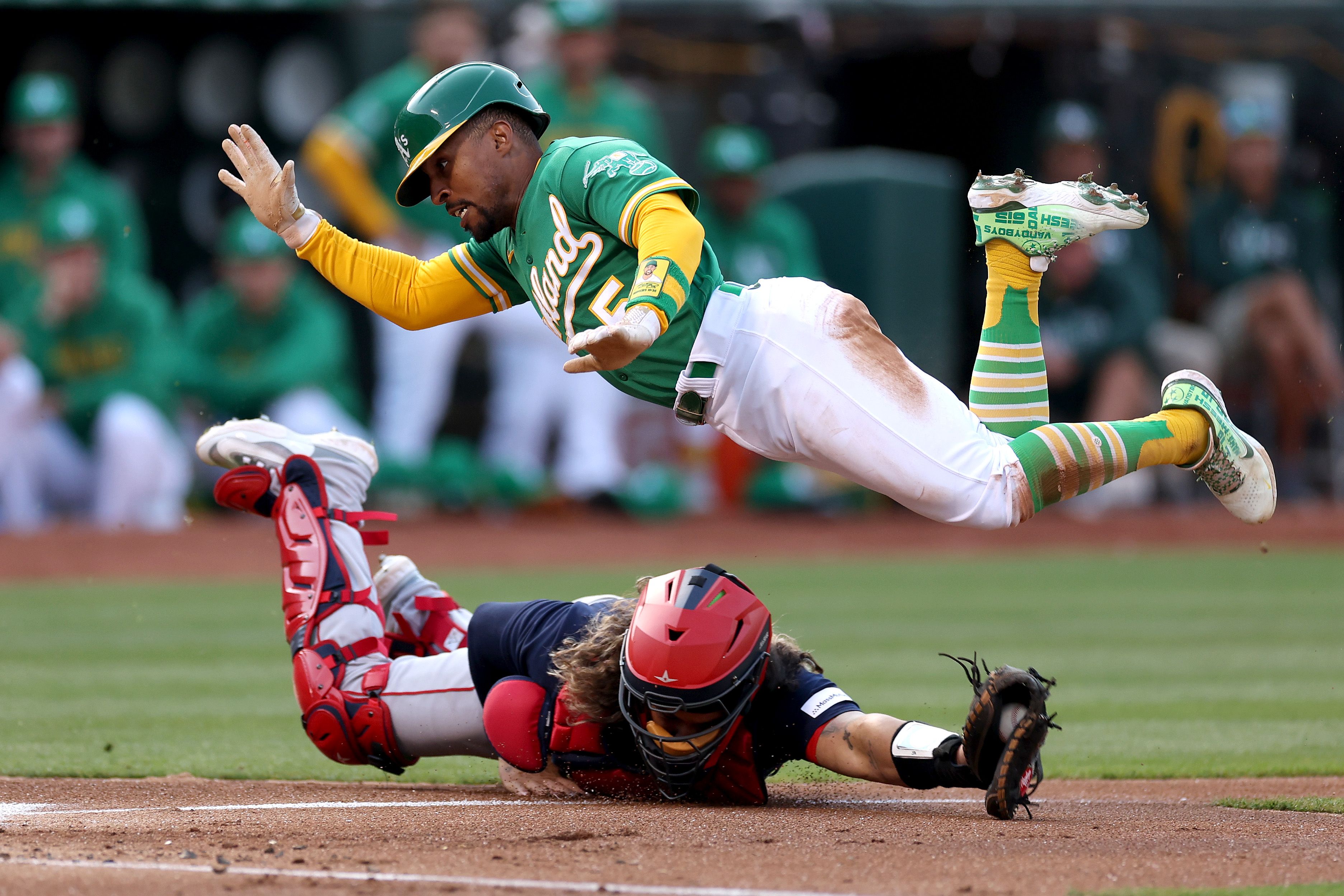 tony kemp diving over catcher