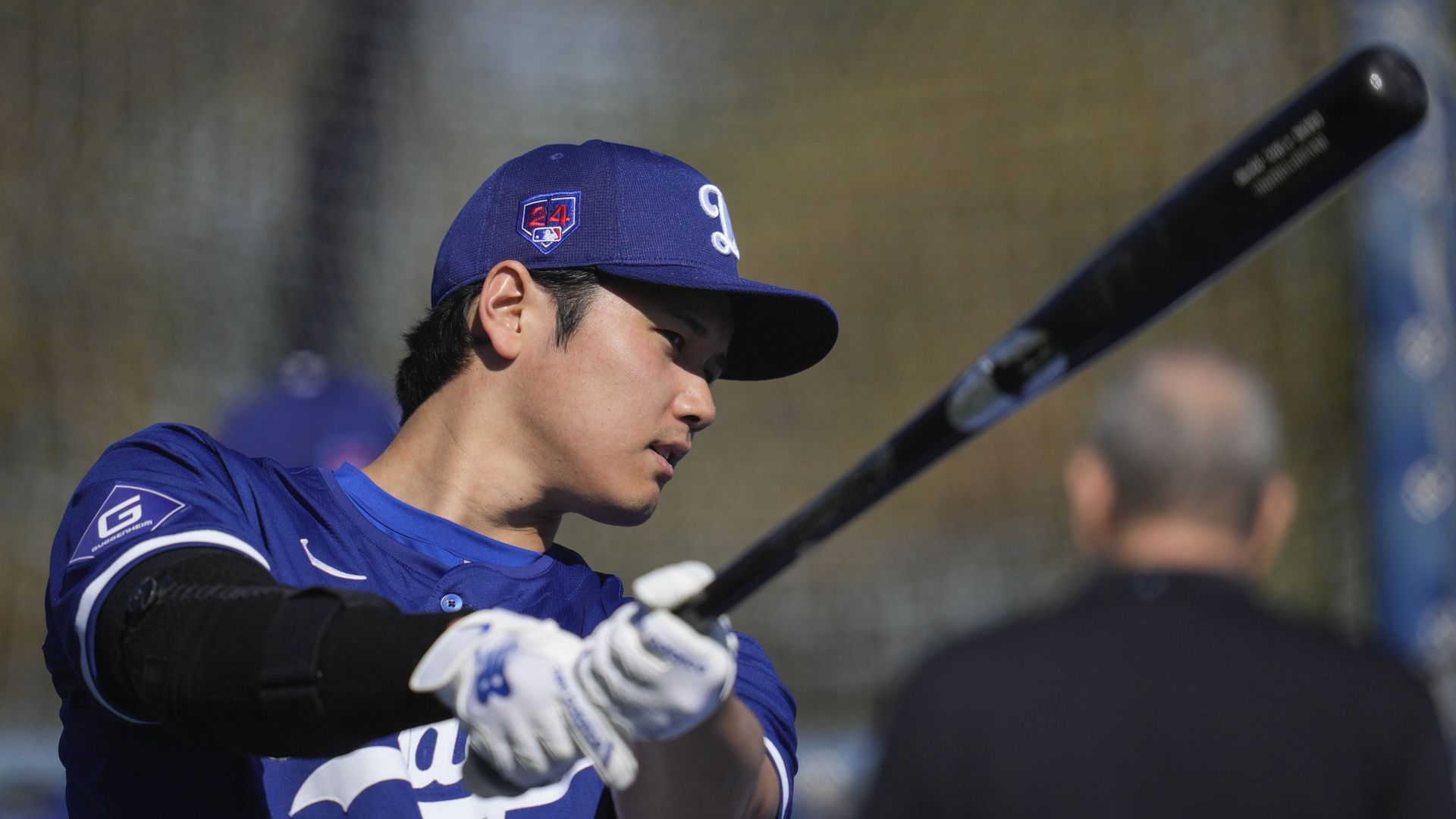 Los Angeles Dodgers designated hitter Shohei Ohtani swinging a bat