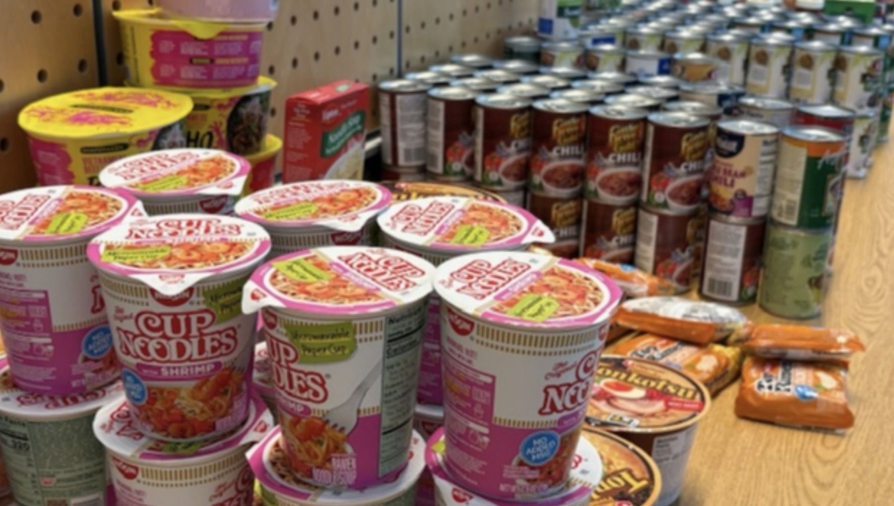 Cans and packages of food line the shelves at SEA's pantry for TSA workers.