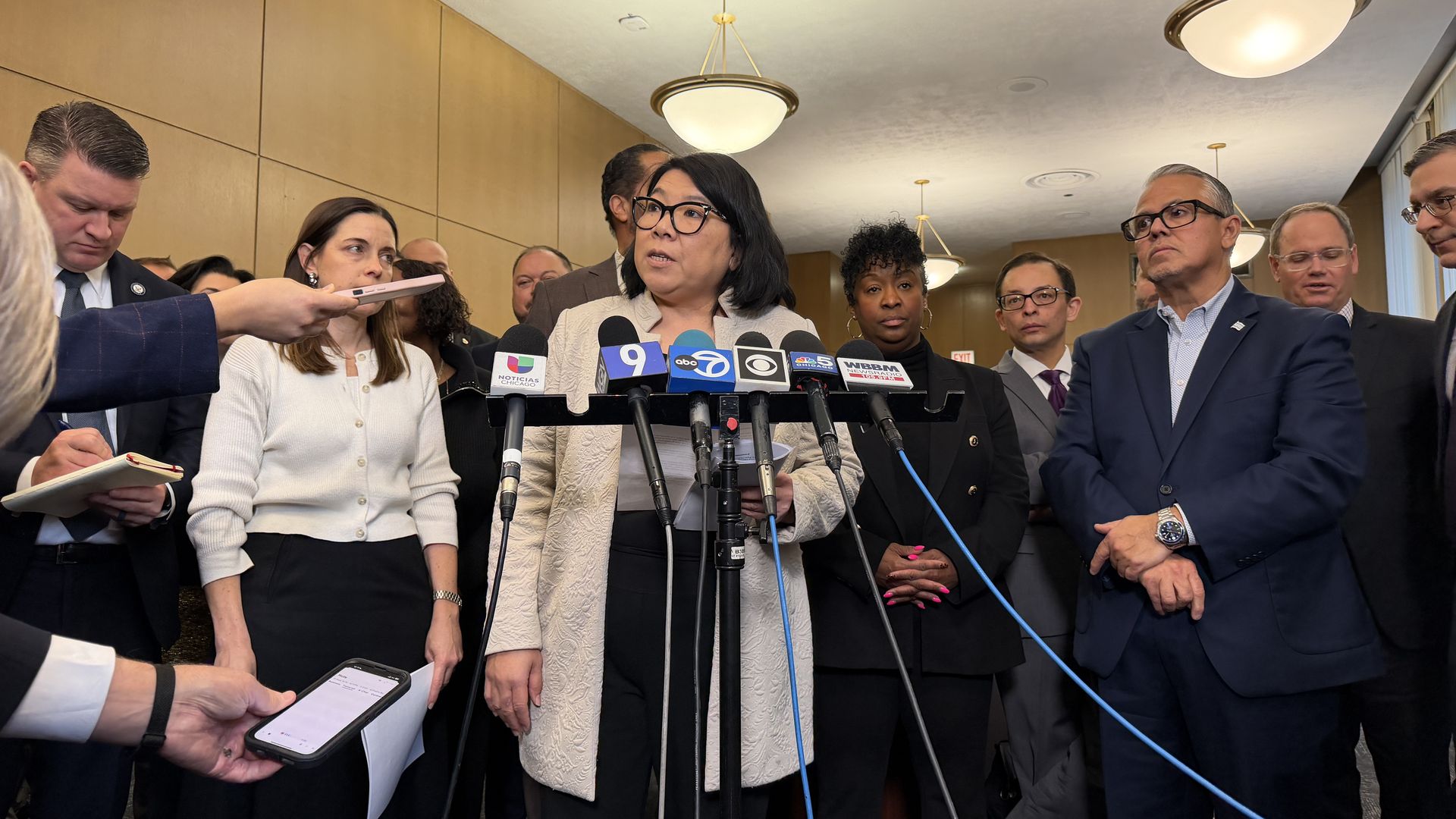 Politicians at a microphone 