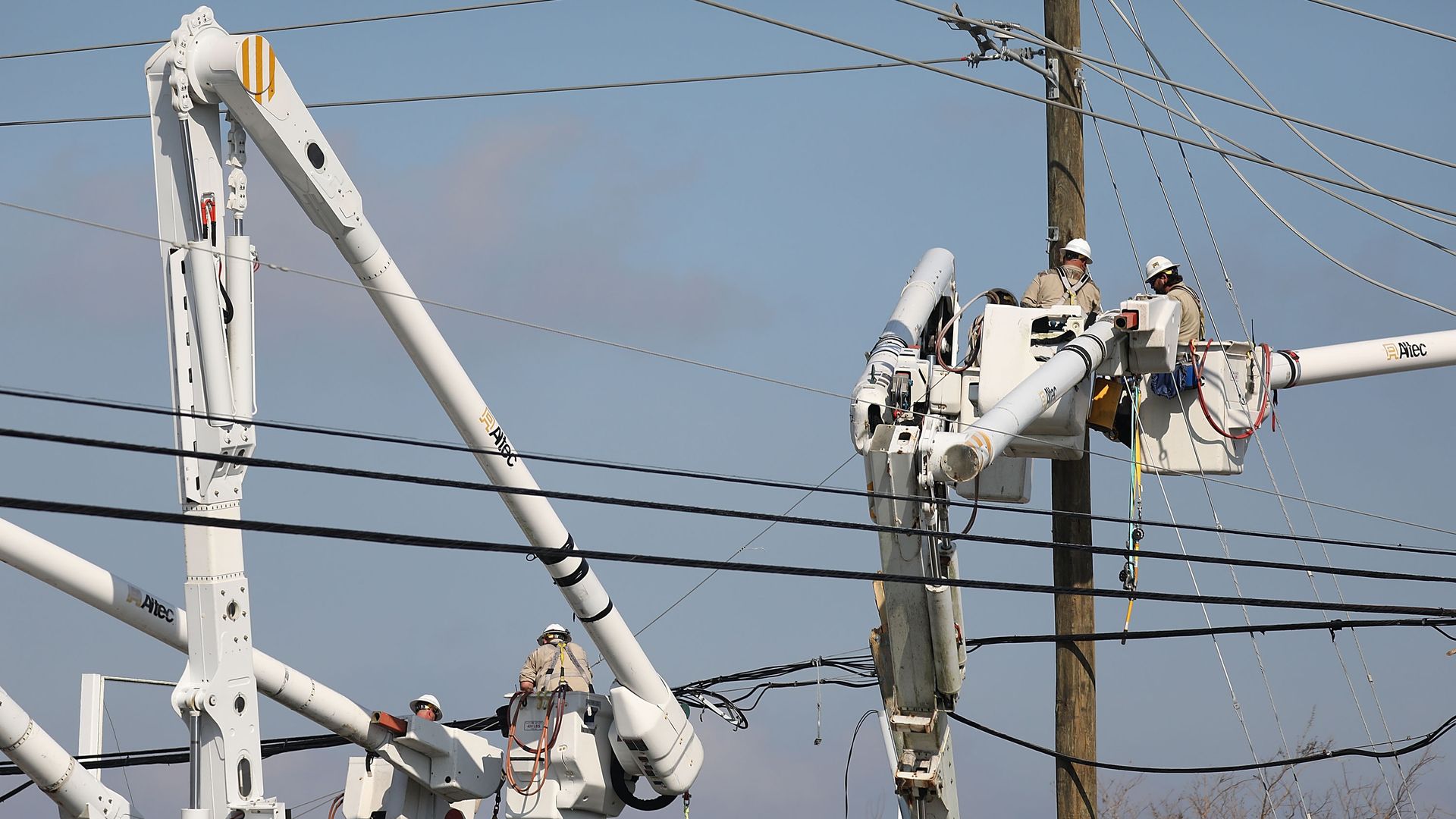 electric workers repair aboveground power lines