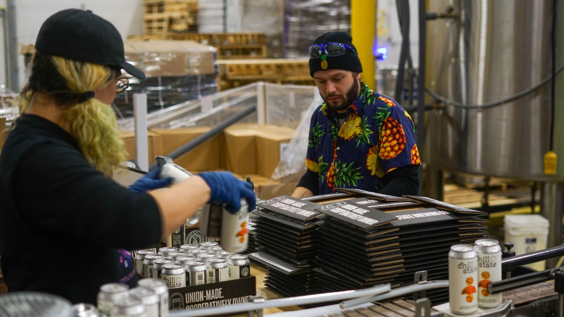 Two people on a production line.