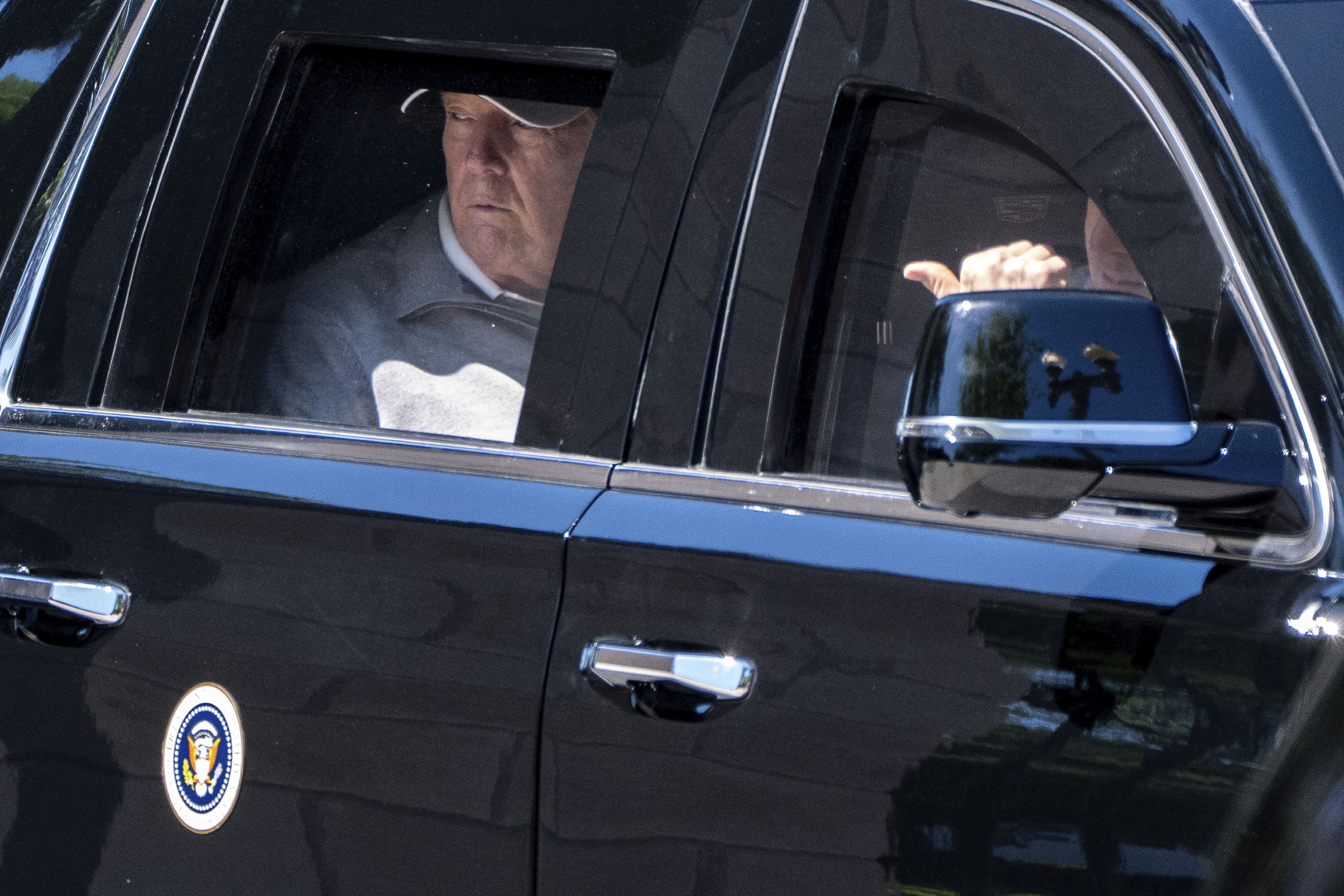 President Donald Trump looks out the window of his limousine at the construction in Lafayette Park as he departs the White House, Saturday, May 30, 2026, in Washington. (AP Photo/Alex Brandon)
