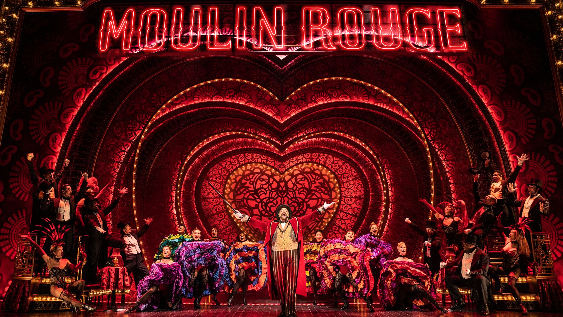 The full cast on stage for Moulin Rouge! The Musical.