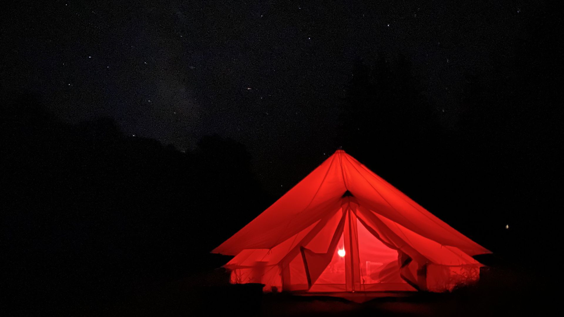 A tent with red light near Cherry Springs State Park.