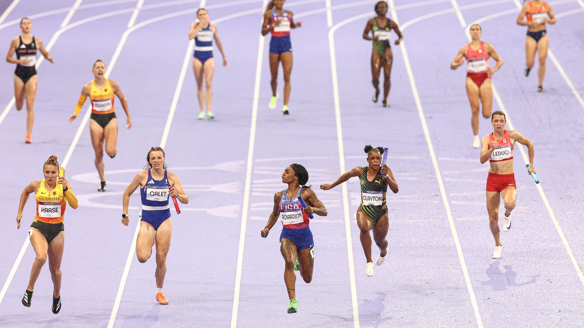 Sha'Carri Richardson is seen staring down fellow runners as she approaches the finish line.