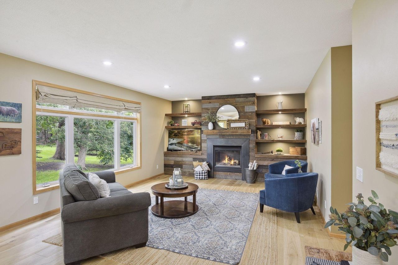 sleek living room area with fireplace