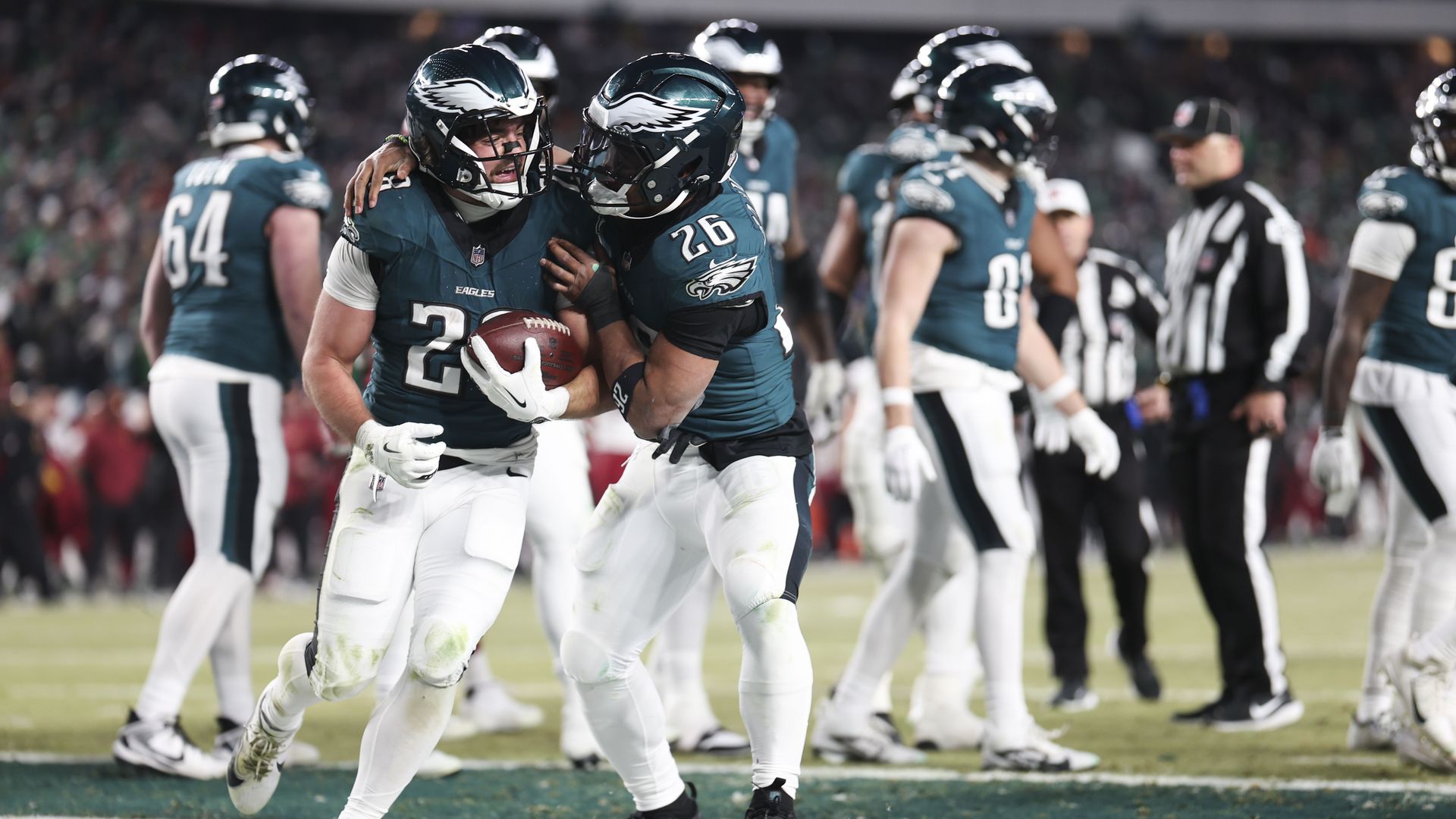 Will Shipley #28 of the Philadelphia Eagles celebrates with Saquon Barkley #26 of the Philadelphia Eagles after scoring a touchdown during the fourth quarter in the NFC Championship Game against the Washington Commanders at Lincoln Financial Field on January 26, 2025 in Philadelphia, Pennsylvania. 
