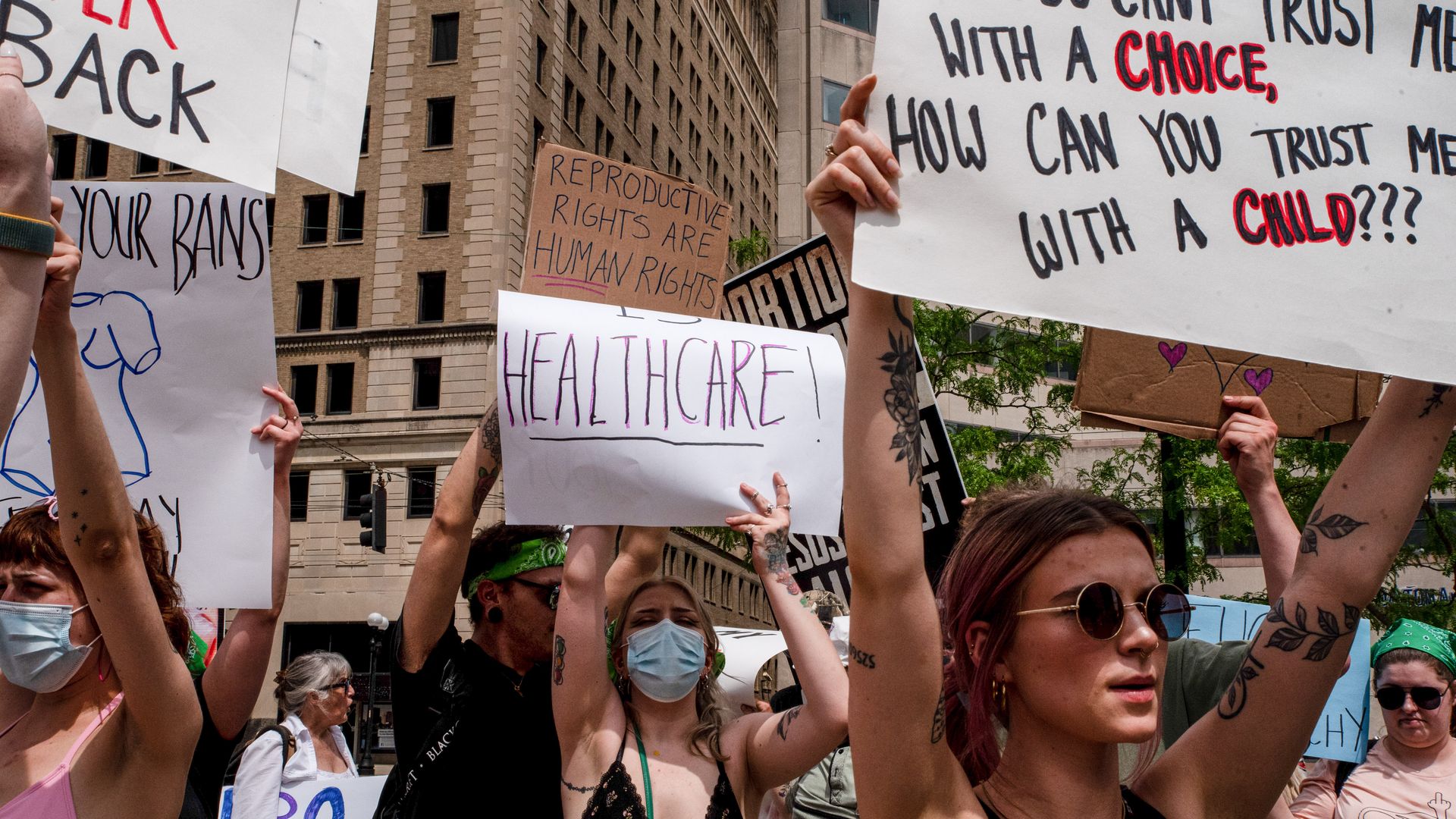 Protestors hold up signs calling for abortion rights.