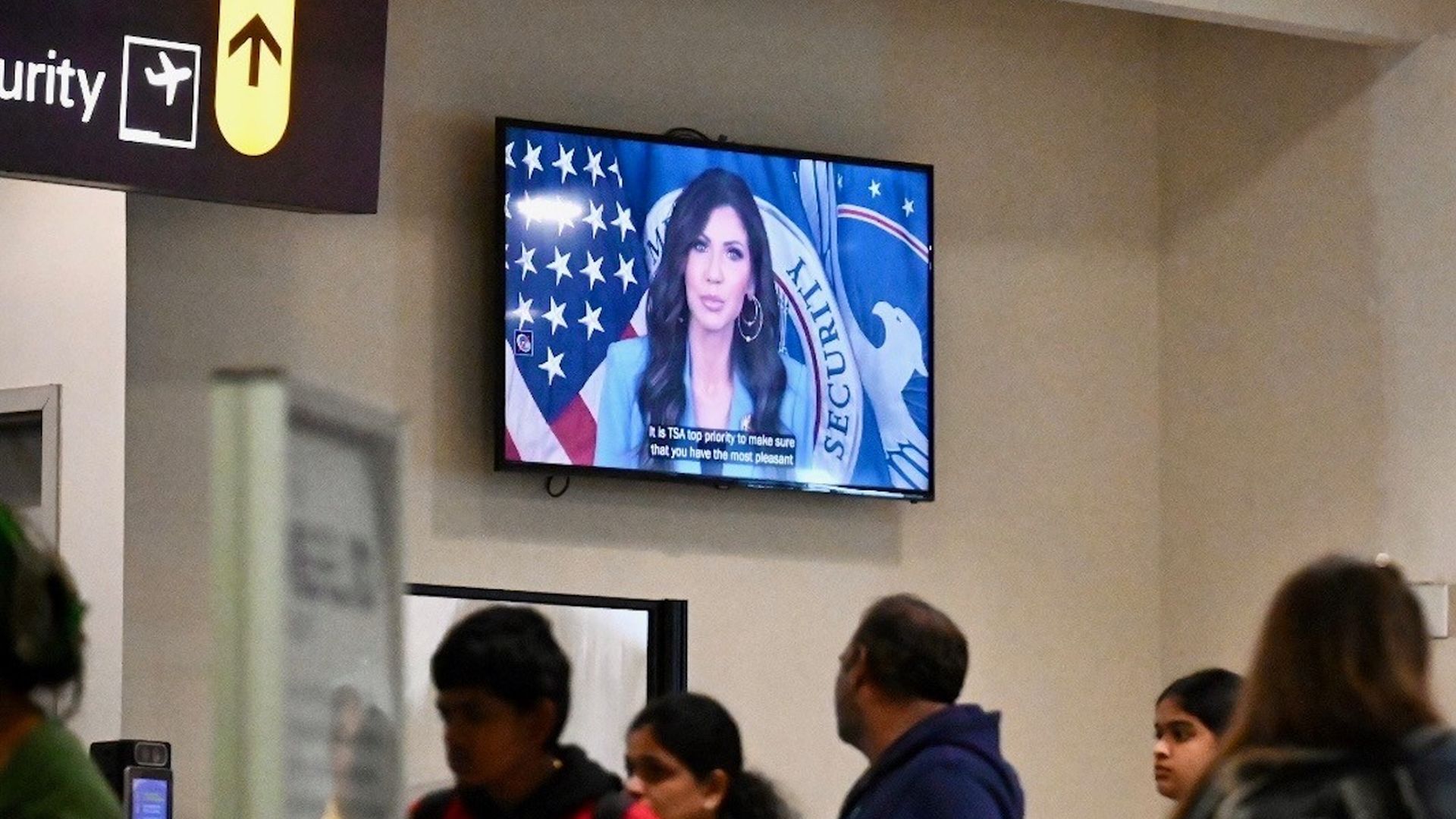 ALBANY, NY - OCTOBER 14: A video of Homeland Security Secretary Kristi L. Noem blaming Congressional Democrats for the federal government shutdown was playing Tuesday at Albany International Airport. (Will Waldron/Albany Times Union via Getty Images)

