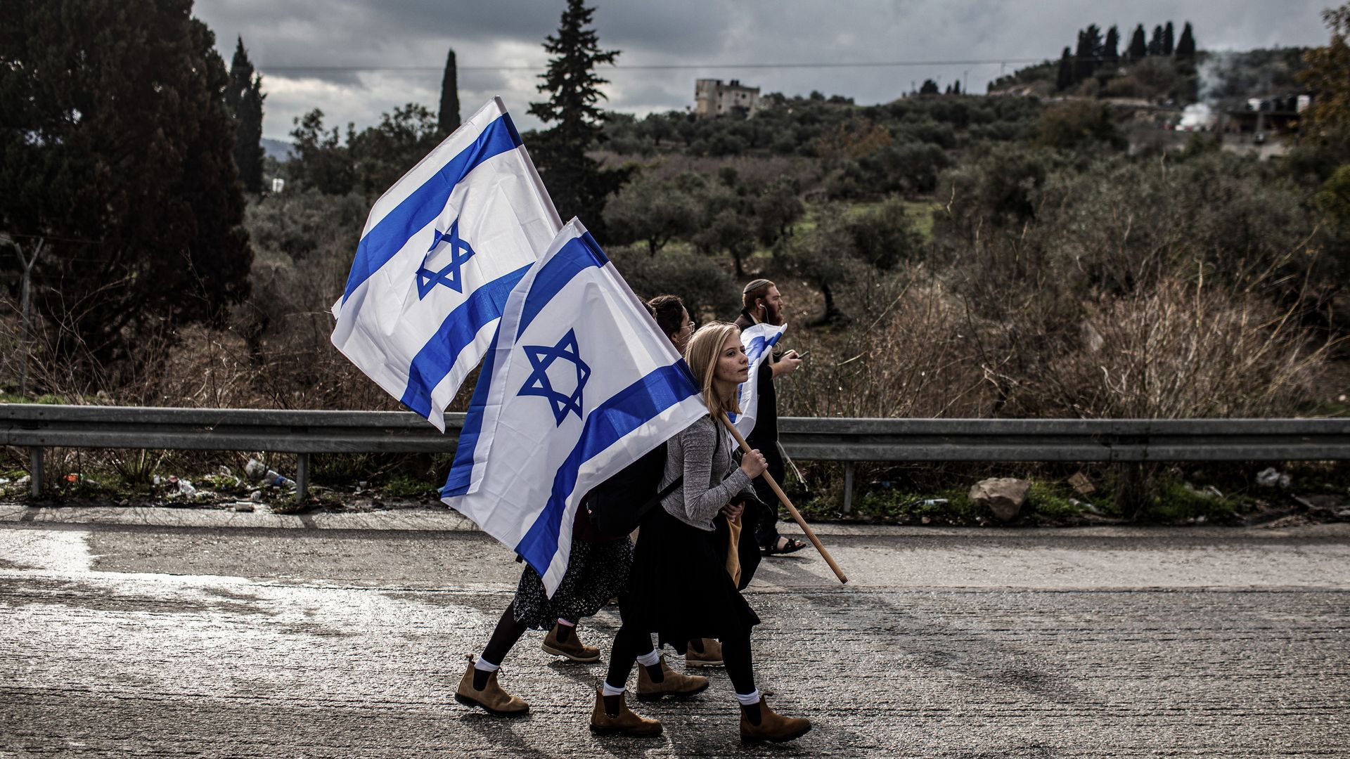 "Israeli right-wing activists and settlers protest in the West Bank outpost of Homesh in 2021. It's unclear which outposts would be affected by the expected second round of sanctions."