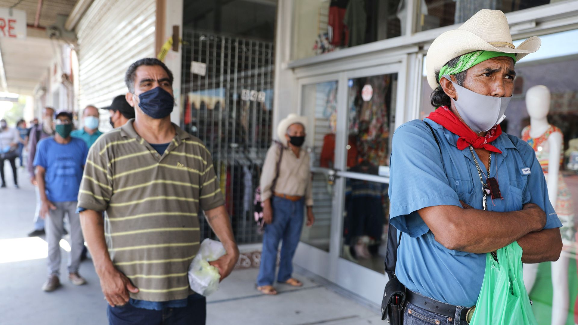 Unemployed Latino workers during the pandemic seek benefits in  Calexico, California.