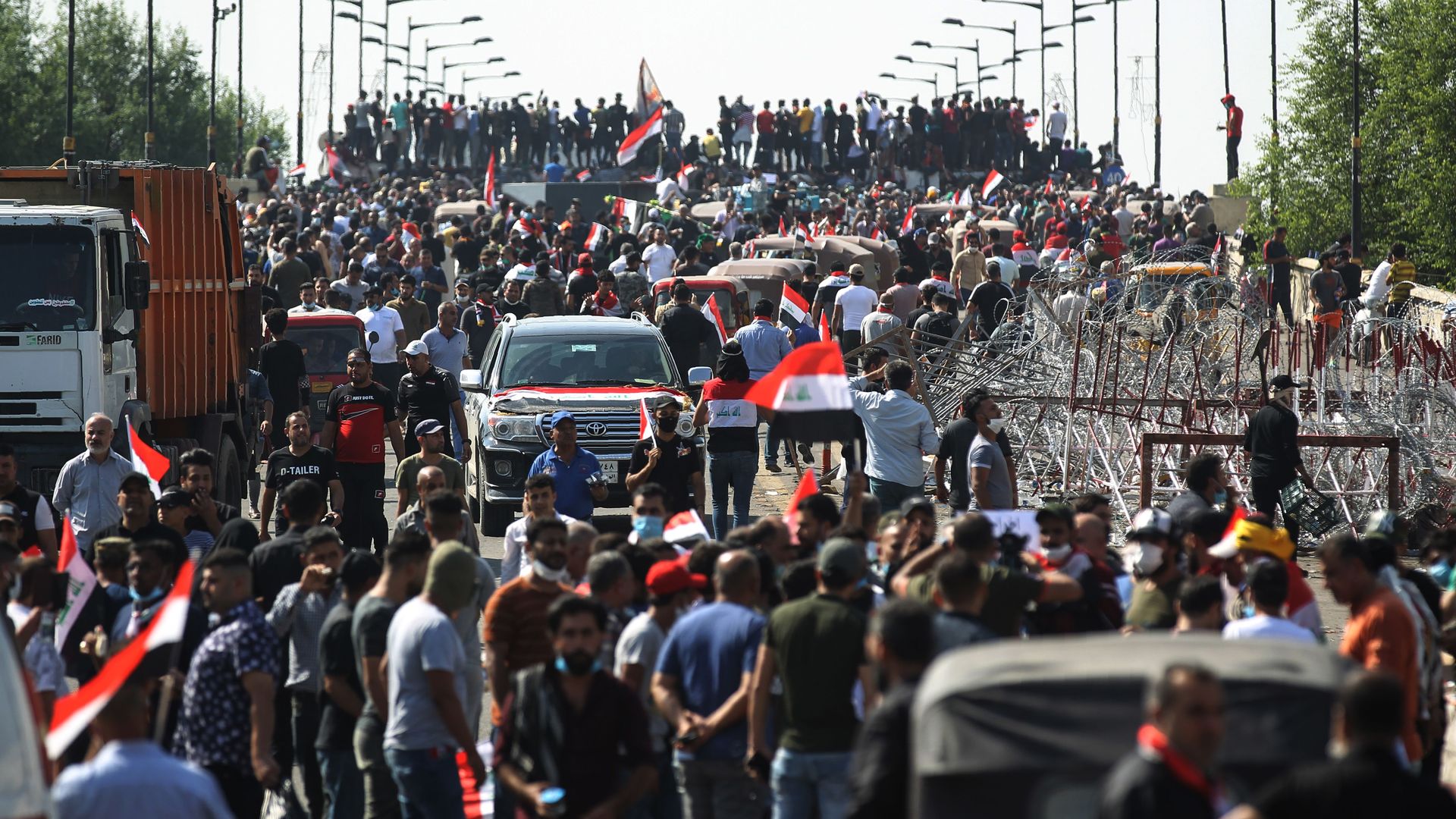 Iraqi protesters gather on the capital Baghdad's Al-Jumhuriyah Bridge
