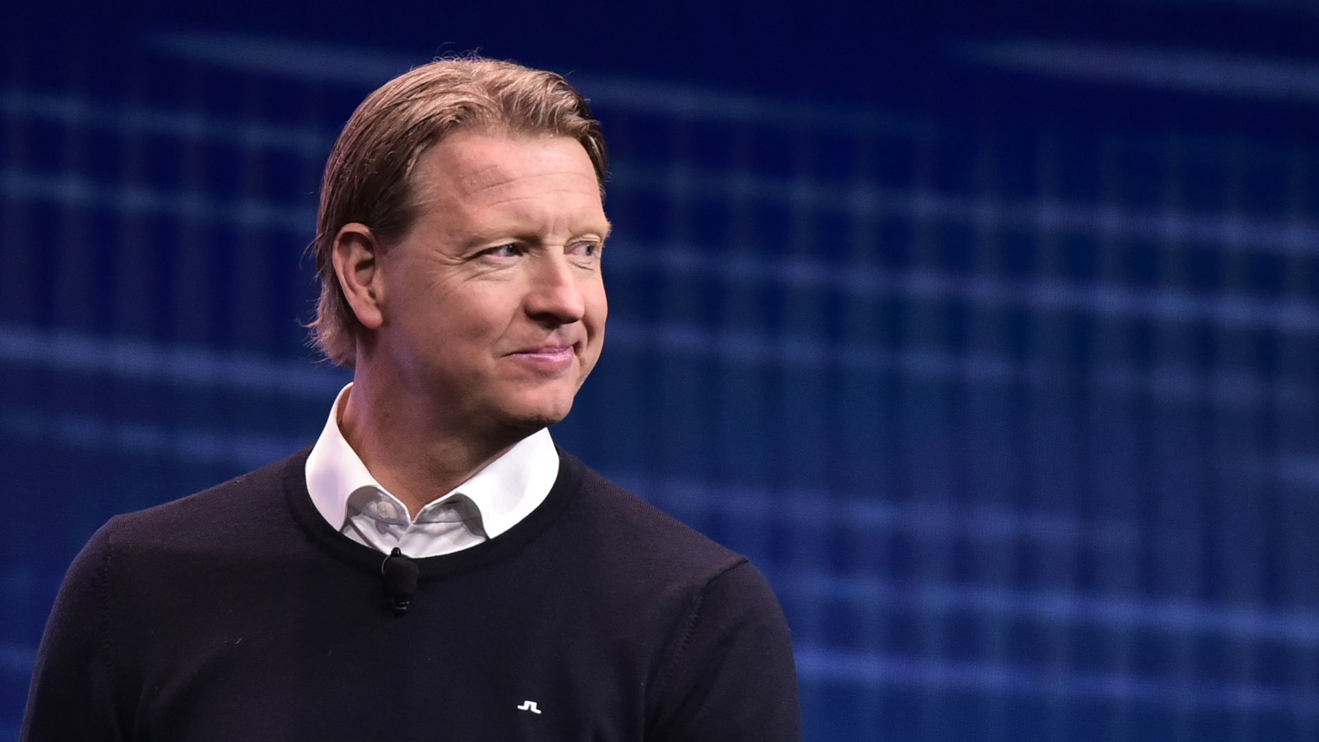  Hans Vestberg smiles on stage at a keynote discussion on 5G and mobile innovation during CES 2018 	
