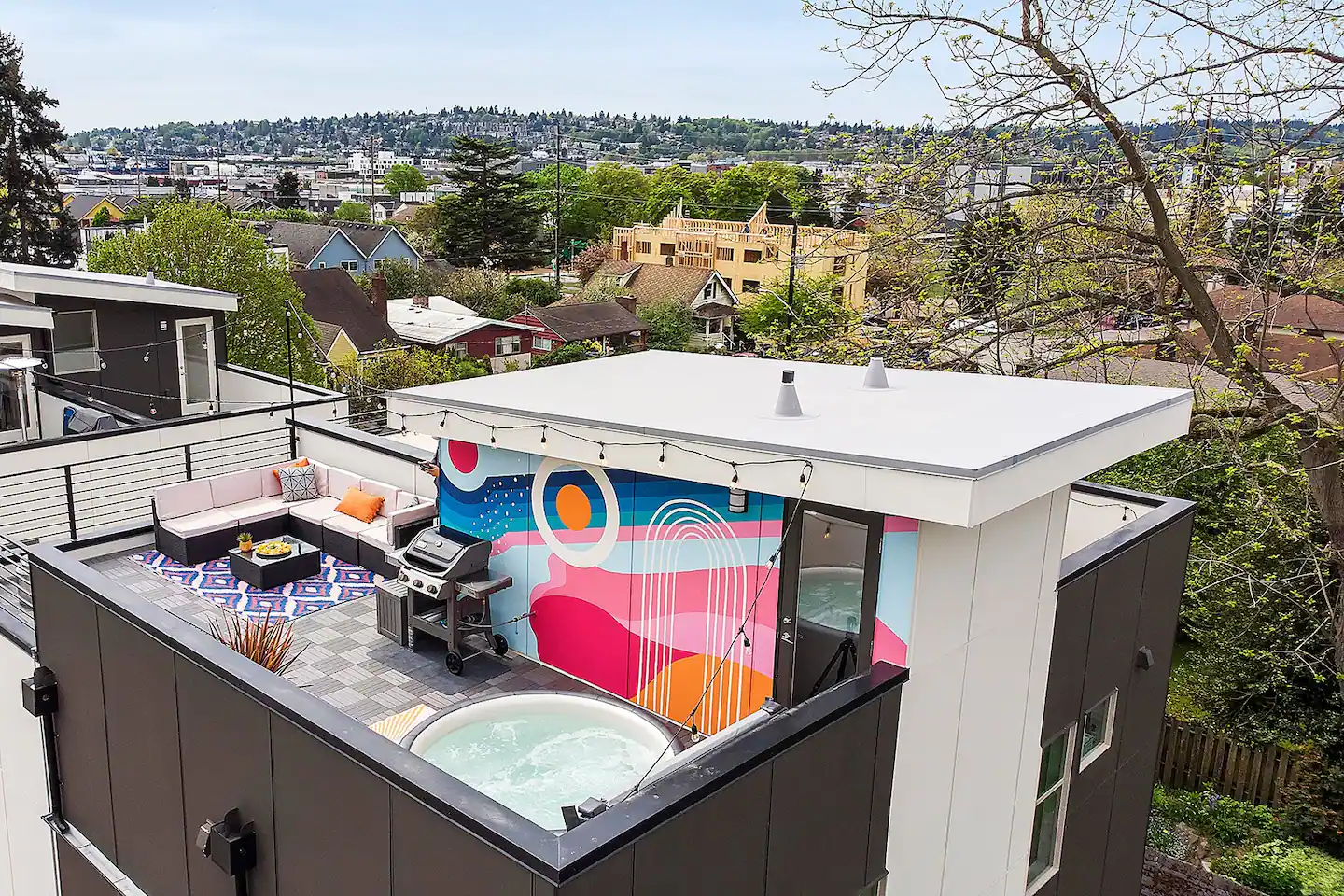 View of colorful rooftop deck on townhouse
