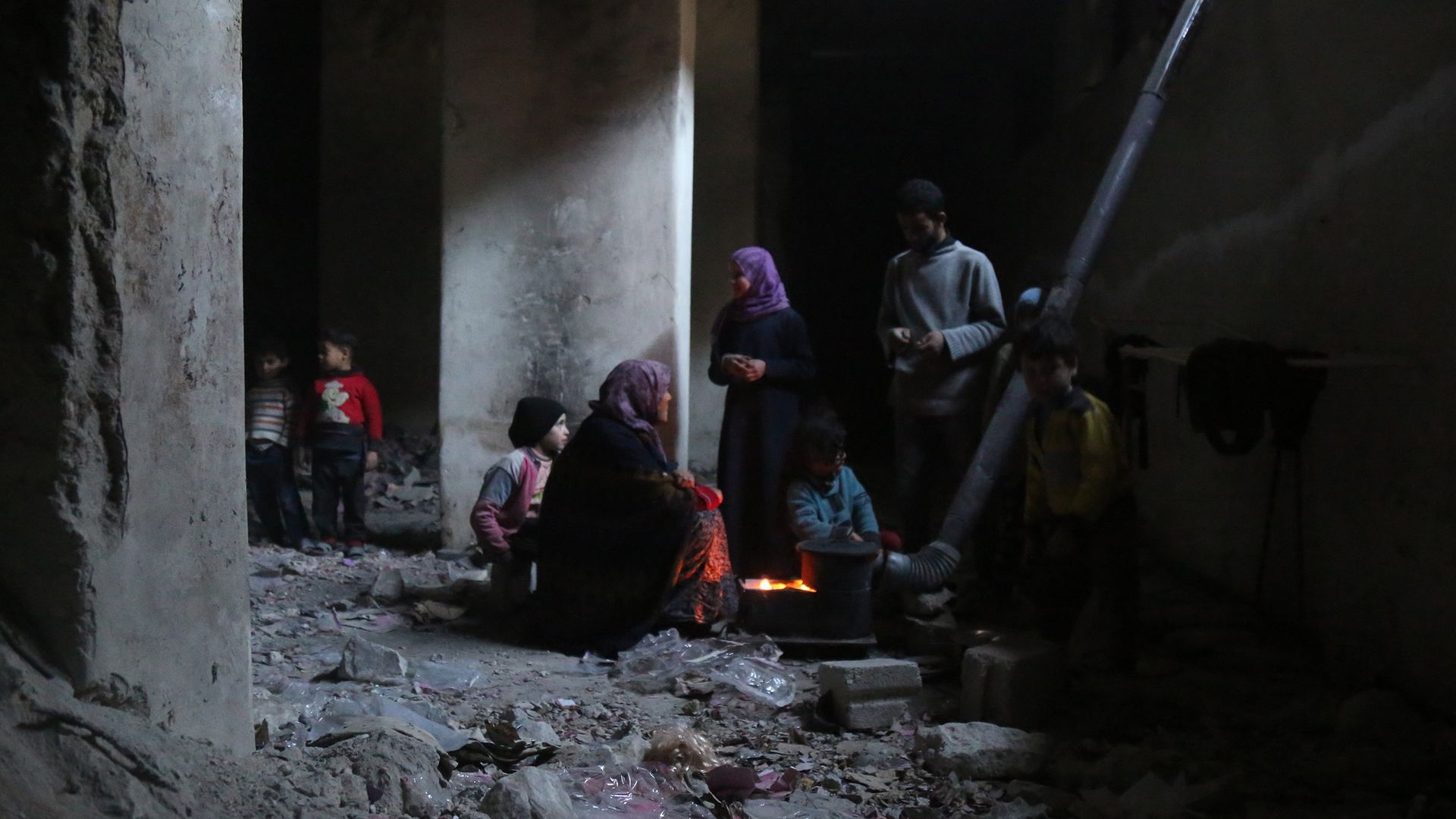 Syrians in basement of bombed-out building