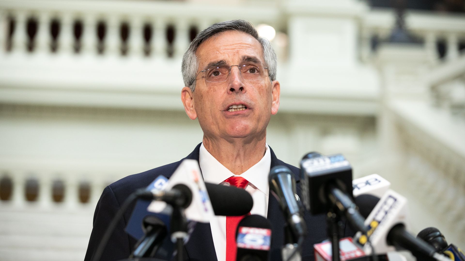 Photo of Georgia Secretary of State Ben Raffensperger speaking at a podium