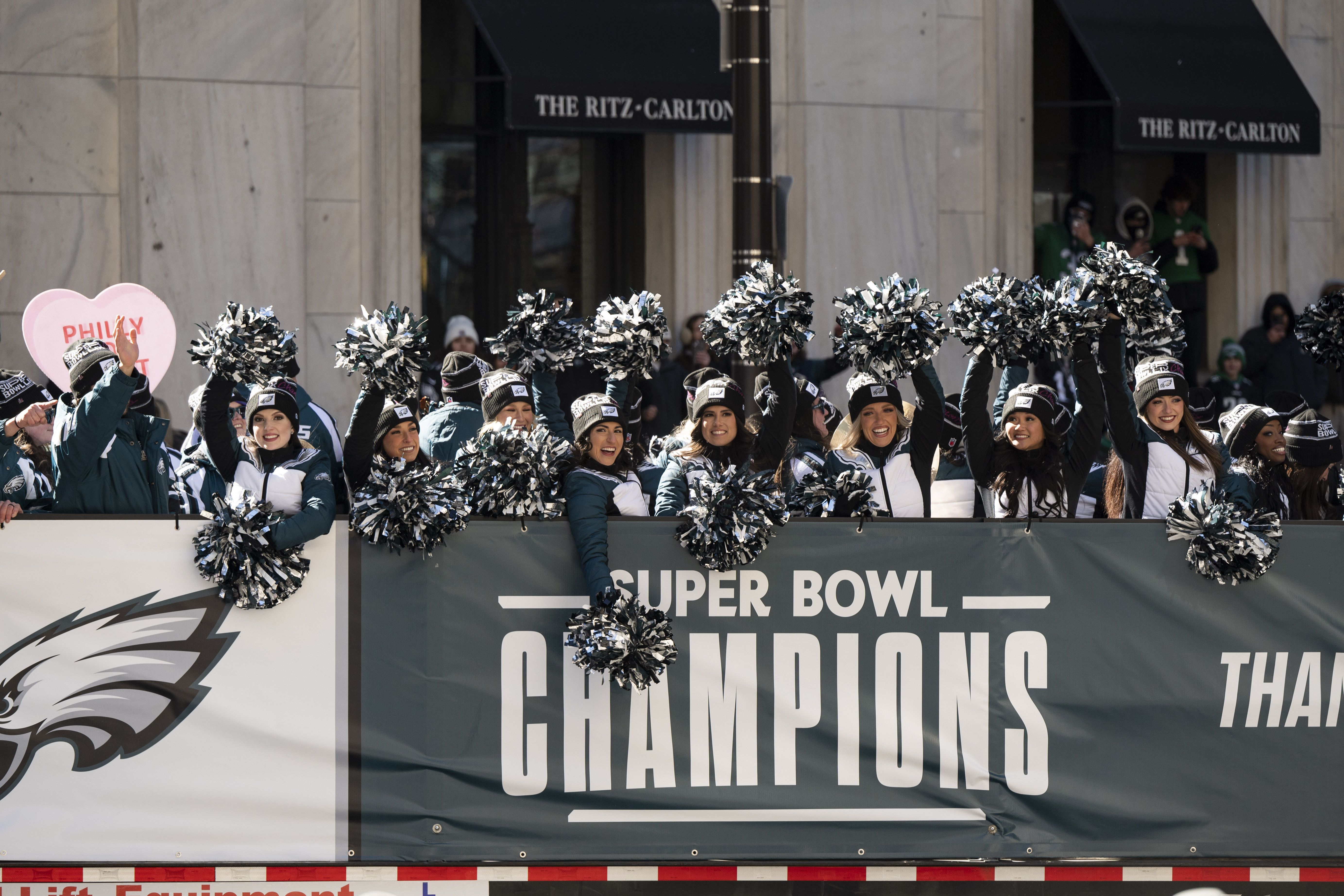 Eagles cheerleaders aboard a Super Bowl Champions bus
